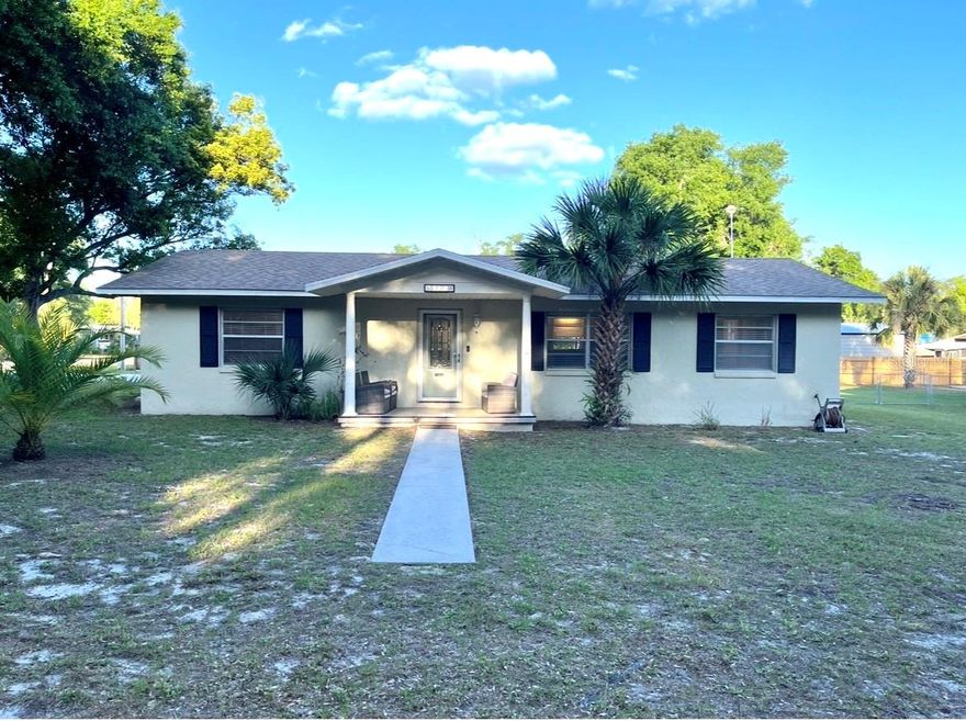 NO HOA + HUGE FENCED YARD + POOL, WELL-MAINTAINED AND MOVE-IN READY.   If you’ve been waiting for a property where you can finally have space, freedom, peace of mind and no restrictions—this one is worth a look.  3 BR 2 BA block home on .41 acre corner lot.  Bring your boat, RV, or toys.  Above-ground pool + charming screened lanai. Major updates already done: Roof, A/C, Septic.  This is the kind of property buyers ask for all the time… but rarely find at this price point. Picture what YOU will do with this much yard space? Pool party setup? RV parking? Garden? Workshop? Find the best of Florida small town living convenient to shopping, entertainment, health care and schools.