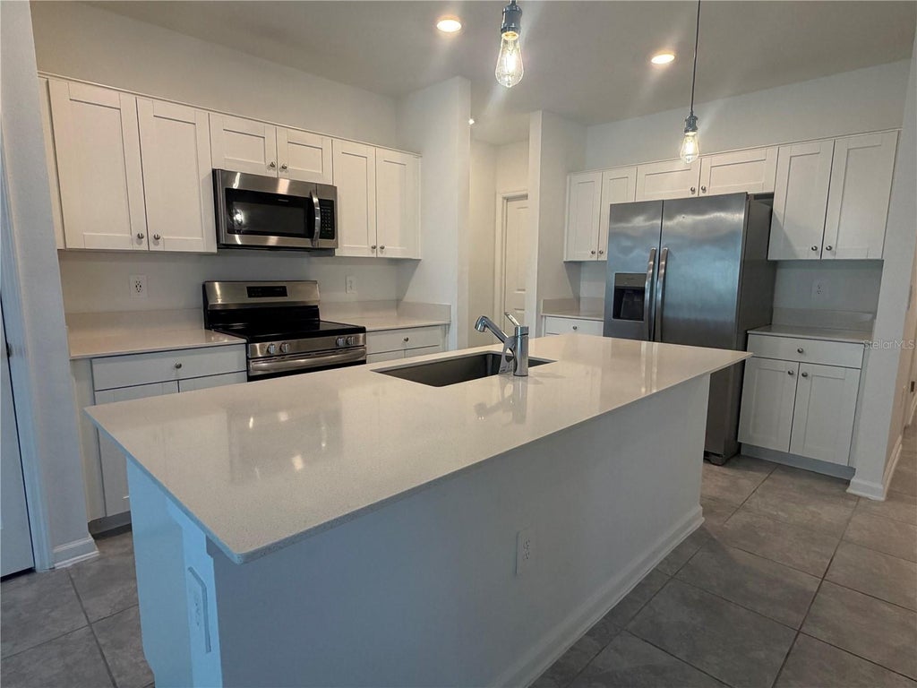 Photo of 537 Sea Turtle Lane, Haines City, FL 33844 (MLS # O6449583)