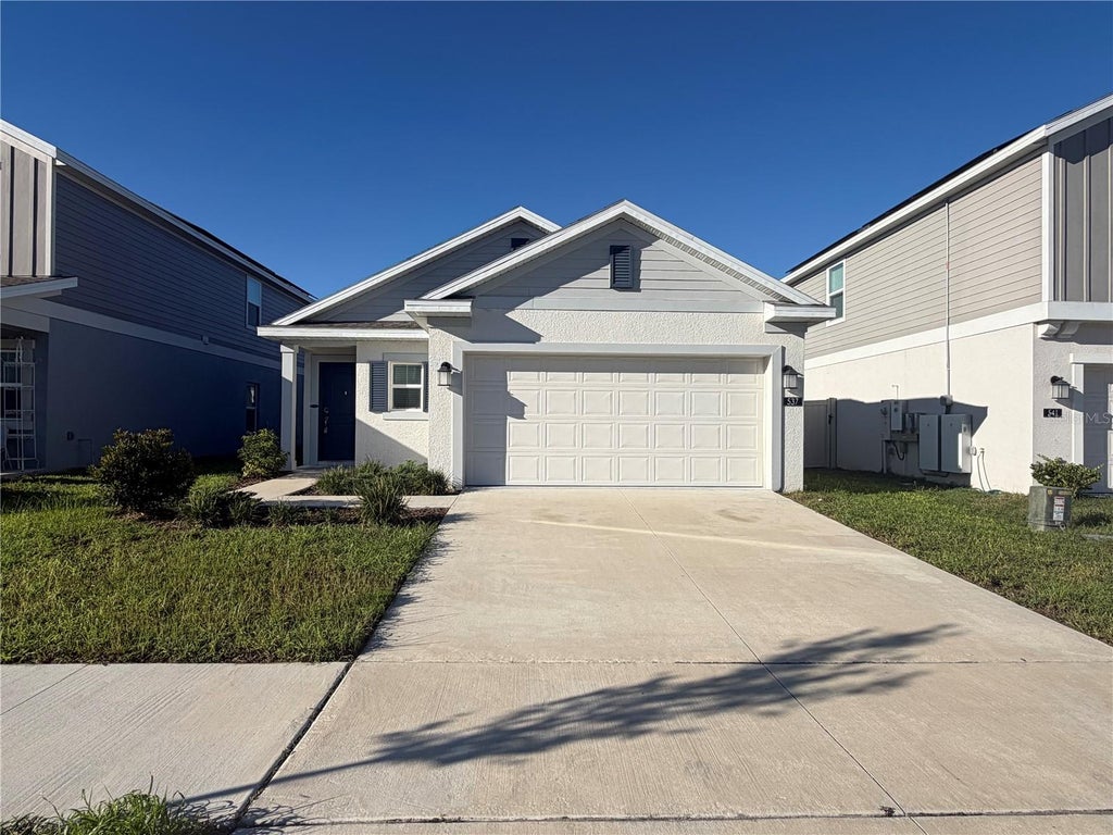 Photo of 537 Sea Turtle Lane, Haines City, FL 33844 (MLS # O6449583)