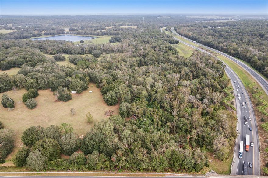 This vacant land offers a wonderful opportunity to bring your vision to life. Its spacious and versatile setting provides endless potential for development, whether for residential, commercial, or recreational use. Surrounded by natural beauty and conveniently located, this site promises a bright future for any project you choose to pursue. This is a great opportunity to develop 8.10 Acre Lot in Spring Lake, Florida, located southwest of Brooksville area of Hernando County. The vacant lot has 352,883 sq. ft of wooded land available to develop the green space into a mix-used town. The northwest corner lot is approximately 900 ft frontage on I-75. This piece of parcel is zoned agricultural and is visible where the interstate Hwy 75 crosses under the bridge. The land has an underground stream of spring water. Please contact the Hernando County Building, Zoning and Planning Divisions or any other municipality designated to assist with the land-use and permits. For a faster street view, use street address number 28063 to pinpoint the closest distance to the property or click on the map and use the street view generated from the listing.
