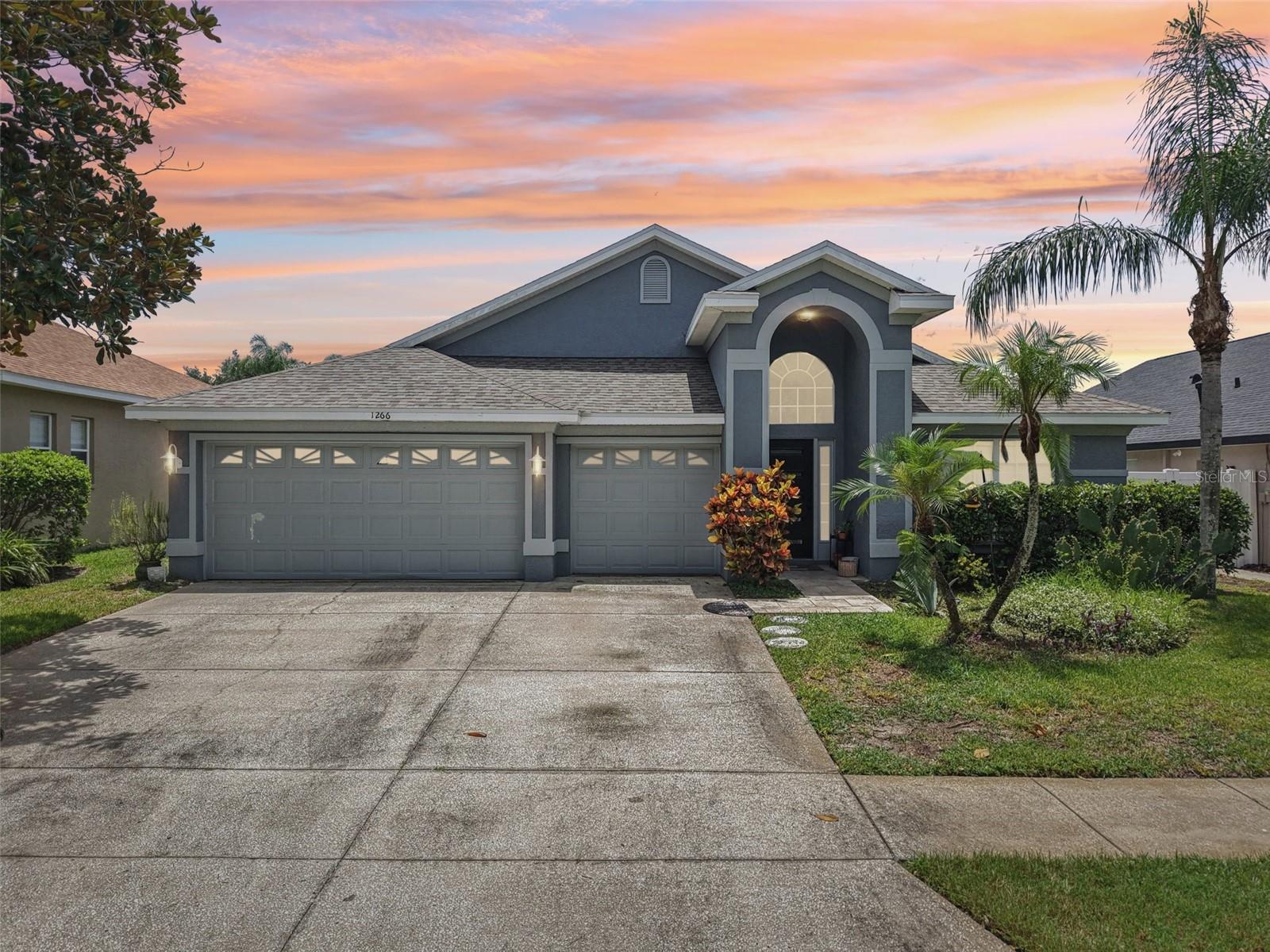Situated in the private, gated North Lake community of Tarpon Springs—featuring two entrances, a pier on Salt Lake, and a dock on Leisure Lake—this spacious 3-bedroom + flex/office room, 3-bath home with a 3-car garage offers the perfect mix of comfort, nature, and convenience. Enjoy water activities, nearby parks, and access to the Pinellas Trail for biking or hiking, all just minutes from beaches, the Sponge Docks, shopping, dining, and a sports complex. Inside, the open floor plan connects to a screened saltwater pool surrounded by tropical landscaping, with solid wood cabinetry, granite counters, glass appliances, and a large kitchen island overlooking the patio. With two primary suites, walk-in closets with personalized cabinets and shelving, a dedicated pool bath, and a garage outfitted with a fridge, sink, and opener—this home is both functional and relaxing. Tile flooring throughout the bedrooms, a newer water heater, roof (2022), pool salt system (2022), exterior paint (2020), and brand-new HVAC (2025) make it truly move-in ready. Irrigation system, front-load washer/dryer, and full access to the boardwalk and lake dock complete the package! Don't miss this opportunity, schedule your showing today!