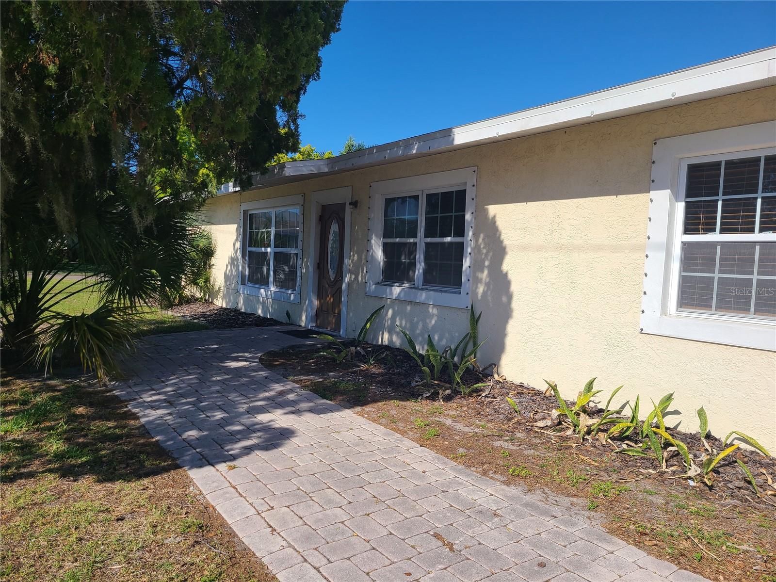 Renovated Light and Bright Corner lot house 4-bedroom 2 bath plus open den. 4th bedroom could be a bonus room/office. Upgraded bathrooms. Walk in Closet with shelves. Backyard is fenced in. 2 car garage with work area. Retro Terrazzo floors, Tile and laminate throughout. No Carpet! Fantastic location. Great schools. Short distance to Sarasota Memorial Hospital, restaurants and everything you can think of. Pet okay with owner approval and nonrefundable pet fee. Washer and Dryer included. Lawn care included in rent. Move in before school starts.