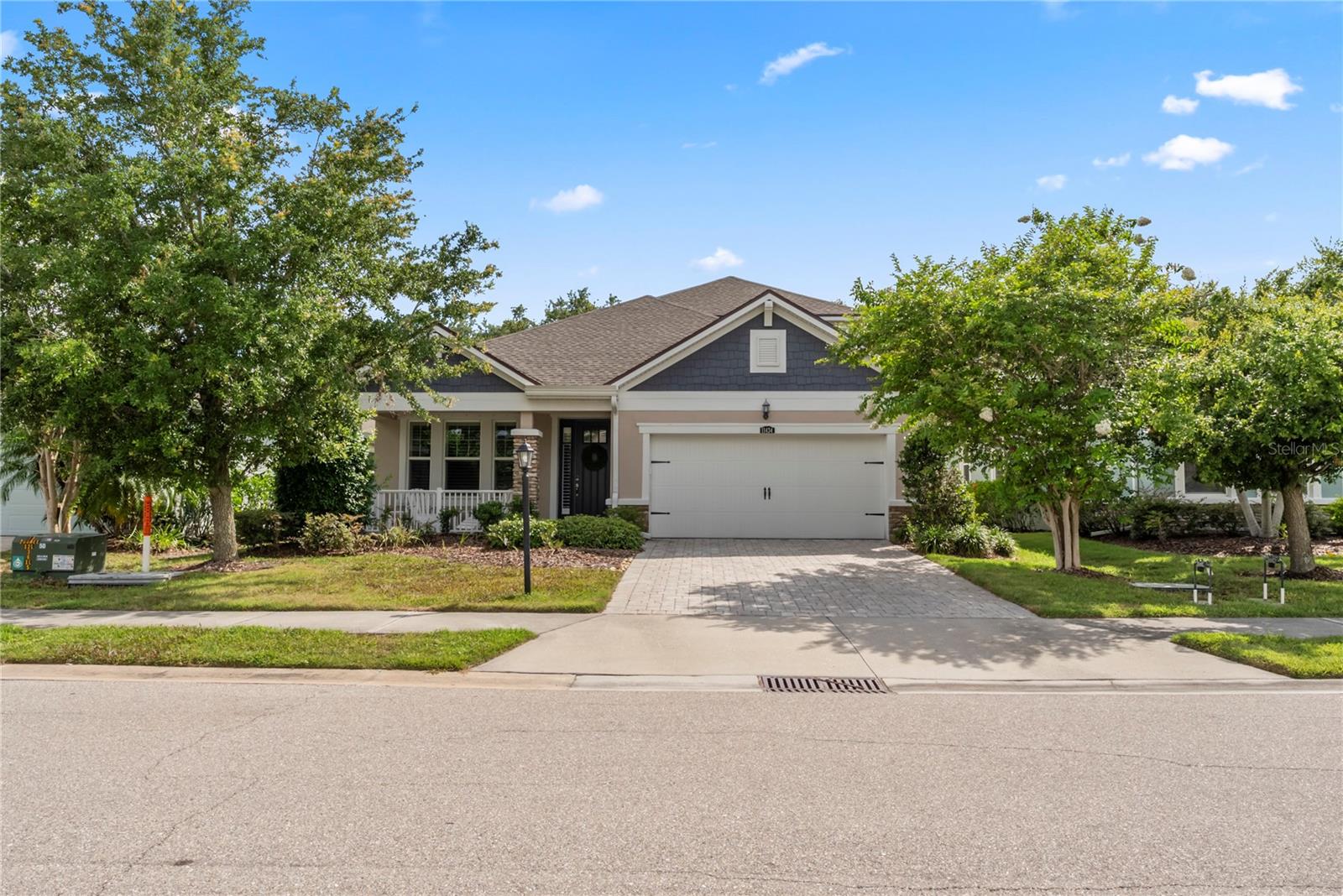 Welcome to the gated section of Harmony at Lakewood Ranch, where you’ll discover this beautiful maintenance-free home with a premium southern-exposure backyard bordered by a preserve. This spacious and thoughtfully designed home features 4 bedrooms, 3 full bathrooms, a den, and a large second-floor bonus/media room—ideal for flexible living. The open-concept layout includes a gourmet kitchen with wood cabinetry, stainless steel appliances, granite countertops, walk-in pantry, and a large one-level island with breakfast bar that flows seamlessly into the dining area. The great room opens to a screened paver lanai, perfect for outdoor entertainment or relaxing. The master bedroom offers a peaceful haven with a huge walk-in closet, and an ensuite bath featuring double sinks, granite countertops, a glass-enclosed walk-in shower, and a garden soaking tub. Two additional bedrooms and a full bath are conveniently located on the main floor, along with a den/home office with glass French doors—ideal for quiet calls or remote work. Upstairs, a generous bonus/media/game room offers the perfect setup for movie nights or a playroom, along with a fourth bedroom and a third full bath, creating a great guest. Additional features include: a new roof installed in February 2025, engineered hardwood flooring, plantation shutters, recessed lighting, ceiling fans, tankless water heater, laundry room, water filtration system, a huge walk-in storage closet, electric car charging station in garage, and hurricane shutters. Curb appeal shines with stone accents, a covered front porch, brick paver driveway and walkway, and a back patio with a gas line for your grill. Harmony offers low HOA fees that include exterior lawn care and access to resort-style amenities: newly renovated community pool, clubhouse, fitness center, playground, grilling area, and walking trails. Located close to top-rated schools, golf, shopping, dining, and less than 20 miles to the Gulf beaches. CDD fee is included in the total tax amount. Don’t miss this incredible opportunity to enjoy the Lakewood Ranch lifestyle!