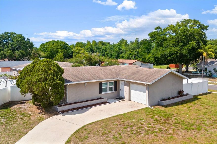 Welcome to 2331 Newton Drive, an exceptional opportunity to own a beautifully maintained residence situated on a fenced corner lot with double gate access to the back yard - perfect for boat or RV parking in the heart of Palm Harbor’s established Green Valley Estates community. Blending comfort, style, and convenience, this inviting home offers a thoughtfully designed layout complemented by abundant natural light and a warm, welcoming atmosphere throughout.
The interior showcases spacious living areas ideal for both everyday living and effortless entertaining. The seamless flow between the main gathering spaces creates an open and airy feel, while tasteful finishes and carefully maintained details reflect pride of ownership at every turn. The updated kitchen features quartz countertops, custom white wood cabinetry, glass tile backsplash, stainless steel appliances, a dinette area, and built-in storage cabinetry, all centrally positioned for functionality and connection, creating an ideal space to gather with family and guests alike. Hurricane-impact windows provide added peace of mind, energy efficiency, and durability.
Outside, enjoy a peaceful residential setting with outdoor space perfect for relaxing, entertaining, or enjoying Florida’s year-round sunshine. The fenced corner lot offers added privacy, enhanced curb appeal, and an expansive feel, creating an ideal setting for both quiet enjoyment and outdoor gatherings.
Ideally located near renowned Gulf beaches, championship golf courses, shopping, dining, parks, and top local amenities, this location offers the perfect balance of tranquility and accessibility. The property is also zoned for highly sought-after Palm Harbor University High School.
Whether you are searching for a full-time residence, seasonal retreat, or investment property, 2331 Newton Drive presents a rare opportunity to enjoy the Palm Harbor lifestyle in one of Pinellas County’s most desirable locations.