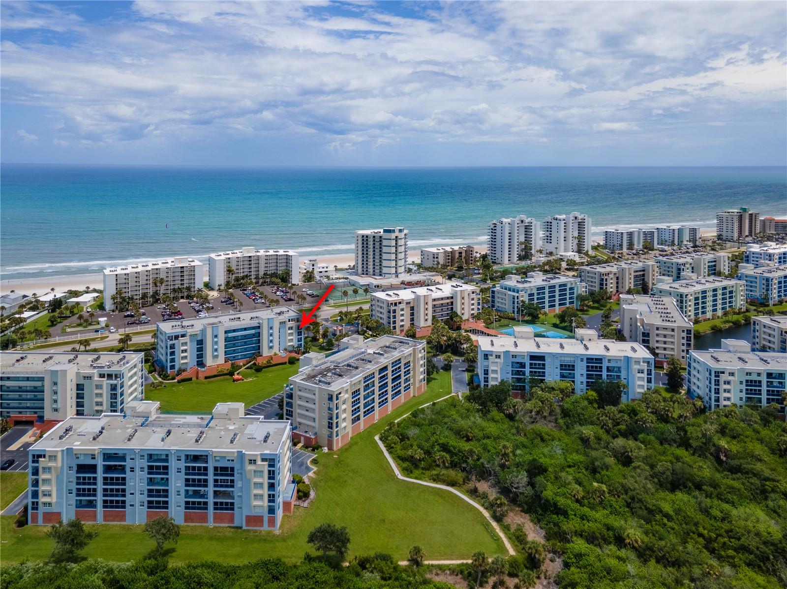 Welcome to Ocean Walk Condominiums, a resort-style gated community. This spacious 5th floor corner unit features three bedrooms, two bathrooms, and 1,768 square feet of comfortable living space. Offered fully furnished and move-in ready, this unit is perfect as a full-time residence, vacation home, or short-term rental investment with no minimum stay restrictions.
This bright and airy condo offers an open floor plan with 9-foot ceilings and ceramic tile flooring throughout. Enjoy ocean breezes and views of the Atlantic Ocean from two private balconies, including one off the primary suite. The hurricane-rated sliding glass doors provide access to the outdoor spaces and fill the unit with natural light.
The kitchen opens to the living and dining areas, creating a welcoming space for everyday living or entertaining. A separate laundry room with a washer and dryer is located inside the unit.
Ocean Walk is a beautifully maintained community with exceptional amenities, including two clubhouses, two heated swimming pools and spas, a fully equipped fitness center, tennis courts, shuffleboard, a theater room, nature trails, BBQ areas, and private beach access. The community is pet-friendly and secured with gated entry and on-site security.
This is your chance to enjoy the Florida lifestyle in one of New Smyrna Beach’s most popular beachside communities. Schedule your private tour today.