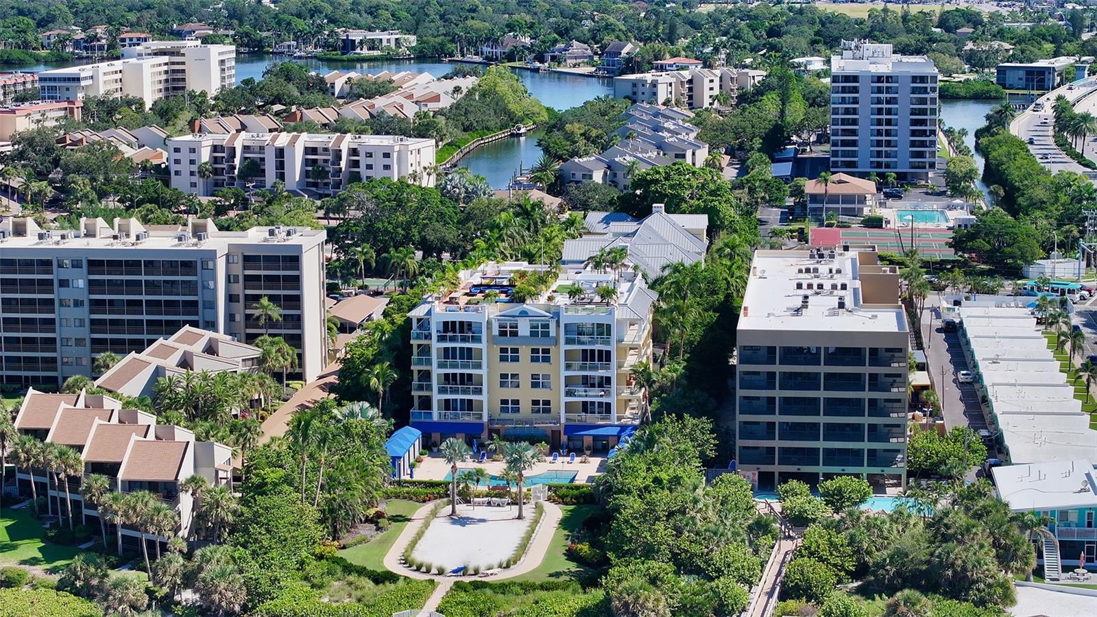Welcome to Seagrove – the quintessential setting to enjoy maintenance-free, beachfront living on Siesta Key. A rare opportunity awaits you as these residences hardly ever come on the market. This gated, private seaside retreat offers the simplicity and refined charm of traditional beach living with the sophistication of a luxurious home. The Seagrove Beach House is a mid-rise building with only 8 exclusive residences. The Penthouse North is the premier residence in the building featuring unobstructed views to the west and north of the beautiful white sand beach and Gulf of Mexico. Enjoy the peace of mind that comes in a building built strong, with hurricane resistant laminated windows. The spacious interior has over 3000 sf of air-conditioned living space with an open floor plan, Gulf views from all main living areas and an open, gourmet kitchen with top-of-the-line appliances. An intimate breakfast room off of the kitchen is the perfect place to enjoy your morning coffee or tea. The large wrap around terrace features see-through glass railings, an outdoor kitchen with gas grill and plenty of room for lounging or al-fresco dining. Penthouse North has its own, approximately 5000sf, rooftop garden with spectacular 360° views, fire pit, outdoor kitchen, putting green and lounge chairs. You must see this to believe it. There is nothing like it on Siesta Key! The community amenities include a grand swimming pool, hot tub, summer kitchen, fire pit, grill & your own private poolside cabana with refrigerator & custom cabinetry. The secure, gated beach access ensures exclusive entrance from the shores of the Gulf. In addition, Seagrove has a full-time, on-site, building concierge who is available to assist with any and all of your needs, including towel service, receiving packages, attending to your residence or even detailing your car! The refined-coastal architecture of Seagrove draws its inspiration from traditional locales such as Savannah, Charleston and the romantic islands of the West Indies. This is the ultimate haven to enjoy intimate relaxation and luxurious elegance. Additional features include secure keyless entry with private elevator lobby, closed-circuit security, private over-sized, air-conditioned 2-car garage with additional storage. Conveniently located close to the south bridge to Siesta Key, accessing the mainland is a breeze. There are dozens of restaurants nearby on the island or across the bridge. Come discover the best of beachfront living on Siesta Key. An opportunity like this does not come around very often.