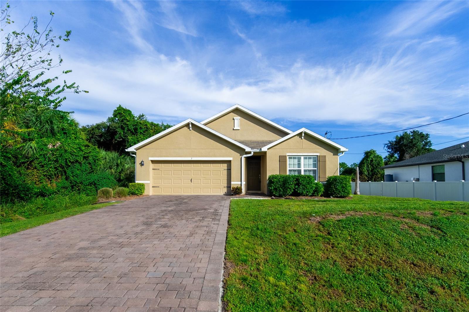 Welcome to this beautifully maintained 4-bedroom, 2-bathroom home, nestled on a tranquil
residential street in North Port. Built in 2019 by D.R. Horton/Express Homes, this “Cali” model
home offers modern comfort without the constraints of an HOA or flood zone concerns as the
property is classified as Flood Zone “X” and survived Hurricane Ian in 2022 with no damage to the home. The property has a Major
Structural Defects 10-year warranty that expires on Feb 4, 2029, which is automatically
transferred to the new owner. Enjoy the convenience of being just minutes away from shopping
centers, schools, churches, hospitals, restaurants, downtown attractions, pristine beaches and
easy access to I-75. This home has an elevated and extended driveway, enhancing curb
appeal, and a comprehensive irrigation system. Inside you will find a spacious open-concept
layout with a split-bedroom floor plan, ideal for families or guests. The kitchen features modern
appliances and ample counter space, perfect for culinary enthusiasts. The master suite offers a
walk-in closet and an en-suite bathroom with dual vanities. Additional highlights include a two-
car garage, energy-efficient windows, and a covered lanai for outdoor relaxation. The property is
move-in ready, allowing you to settle in without delay. Don’t miss this opportunity to own a
charming home in a prime location. Schedule your private showing today and experience all that
makes this property special!