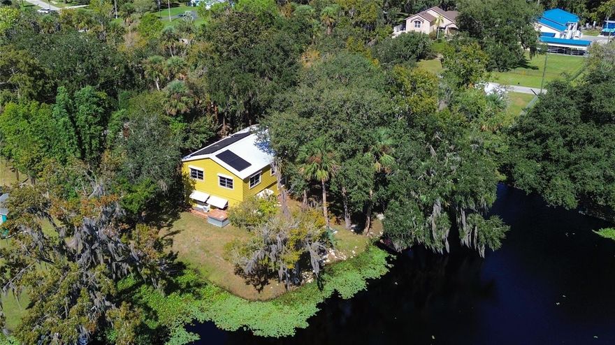 WATERFRONT home on a canal connecting to everything! PRIVATE ROAD - ST JOHN'S RIVER ACCESS! This 3 bedroom, 2 ½ bath home was custom built for a nature lover to enjoy. Fishing, boating, bird watching, you have it all in this quiet two-story home with 2,160 sq ft of living space. This home features a metal roof (longevity) with solar electric panels and roll down hurricane shutters. There is a one car garage, a small wood dock, and plenty of space for all of your grown-up toys (RV, boats, jet skis, trampolines, etc.) Enjoy downtown Deland (Stetson, shopping, healthcare, restaurants!) just 10 minutes away or a quick drive to the beach (40 minutes away).