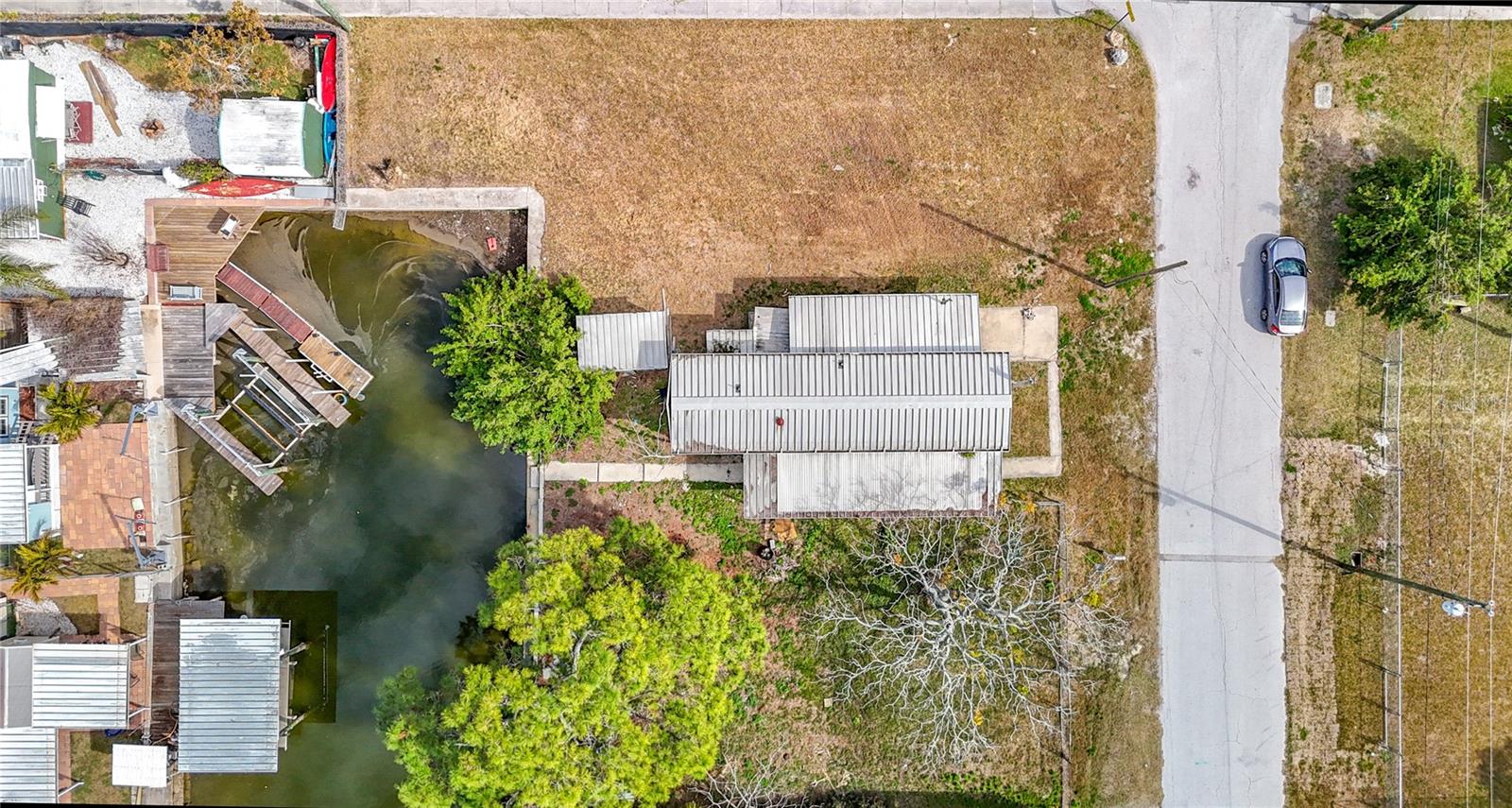 Three lots next to each other on a canal. Build your dream home or investment properties. Currently there is a mobile home on the center lot and owner is looking to have it renovated or the new owner can. Its a nice lot with a lot of potential. Anything with Gulf access is a big plus in these parts and all three lots offer that.