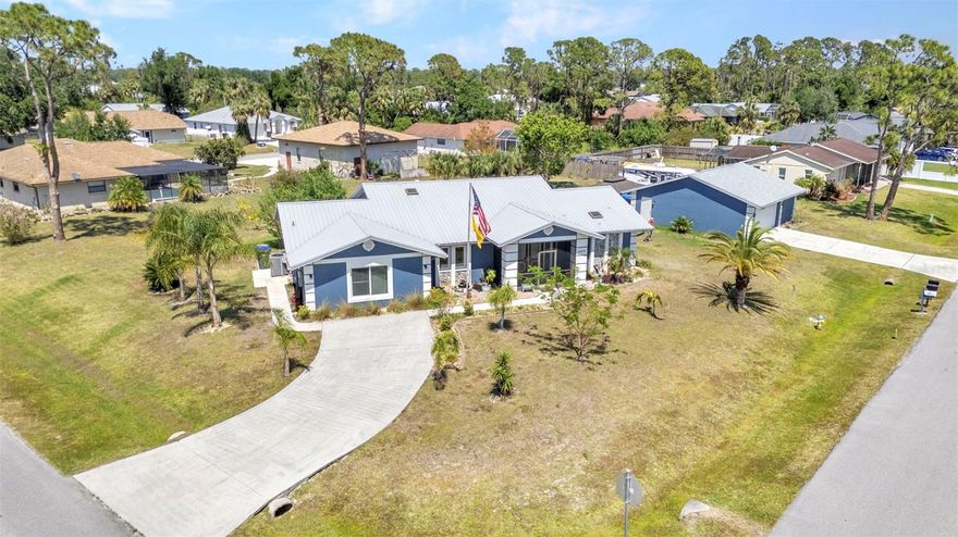 Huge Price Improvement !! Welcome to your dream home! This meticulously maintained 4-bedroom, 2-bathroom gem with a spacious 900 sq ft detached garage is everything you've been searching for.

Step inside this expansive 2390 sq ft home and be greeted by large, airy rooms with cathedral ceilings and a fantastic layout, all protected by hurricane impact windows and a durable metal roof. The inviting living room, cozy bonus room, and welcoming family room make this home perfect for gatherings and creating lasting memories.

The garage has been thoughtfully converted to include a 15 x 7 ft laundry room, a 2 x 5 ft storage area, and a versatile 4th bedroom measuring 18 x 12 ft, ideal for a game room, hobby room, or home gym. The split-concept design offers privacy, with 3 bedrooms on one side and the luxurious primary suite on the other. The primary suite features his and her walk-in closets, and a master bath with a walk-in shower and a relaxing bathtub.

To the right of the home, you'll find a massive 30 x 30 ft detached garage with a double door at the front and a single bay door at the back, perfect for storing equipment, supplies, or your favorite toys. There's even an RV power hookup on the side of the garage. Behind the garage, unwind in the large hot tub under a private gazebo. With just over half an acre of land, there's plenty of room to add a large pool!

This home and garage sit high and dry, so flood insurance is not required. The newer roof and impact windows ensure your investment is protected for years to come. Conveniently located close to shopping, golf, less than 30 minutes to Gulf beaches, MLB Spring Training, fishing, boating, parks, and dining, this location is truly desirable.

Don't miss out on this incredible opportunity – book your showing today and make this dream home yours!