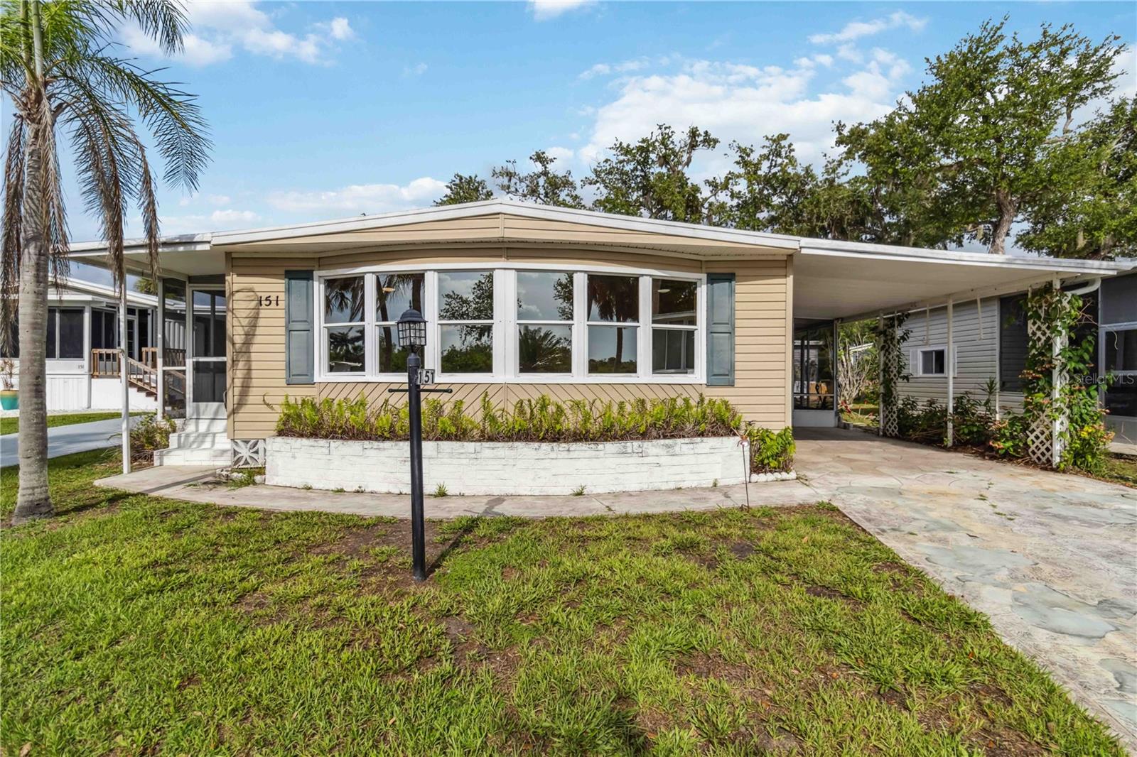 Private dock included~ Welcome to a rare offering in the highly desirable 55+ waterfront community of Eagle Point in Punta Gorda—this beautifully updated 2-bedroom, 2-bathroom doublewide spans 1,104 square feet and blends comfort, convenience, and coastal charm. Recently upgraded with stylish waterproof laminate flooring throughout, the home exudes a fresh, modern appeal. The kitchen features abundant cabinetry and flows seamlessly into the open dining and great room, creating an ideal space for entertaining or simply relaxing in style.
The spacious primary suite offers both a walk-in closet and a standard closet, along with an en suite bathroom for added privacy. The guest bedroom is perfectly appointed with direct access to the second full bathroom, ideal for visiting family or friends. Thoughtfully designed, the interior laundry is tucked neatly into a closet for easy access.
Enjoy Florida living outdoors with two screened lanais—one smaller lanai on the side and a larger one in the front that connects directly to your personal storage shed. The AC was replaced a year ago. But the true highlight of this property is the included private dock, offering direct access to the Peace River, Charlotte Harbor, and the Gulf of Mexico. Whether you're a boater or simply love waterfront serenity, this is a rare bonus you won’t want to miss.
Eagle Point is a resident-owned cooperative community where owners purchase between 5 to 20 shares (at $1,000 per share), reducing monthly HOA fees based on your investment. This pet-friendly neighborhood welcomes two small pets per household and boasts a heated community pool, a picturesque pond, shuffleboard courts, boat storage, and a vibrant calendar of community events.
Located just minutes from the charm of historic downtown Punta Gorda, you'll have convenient access to boutique shops, waterfront dining, live entertainment, and top-rated golf. Plus, with I-75 nearby, day trips to Sarasota, Tampa, or Fort Myers are a breeze.
This is more than a home—it's a lifestyle. Don’t miss your chance to own a piece of paradise in Eagle Point. Schedule your private showing today!
