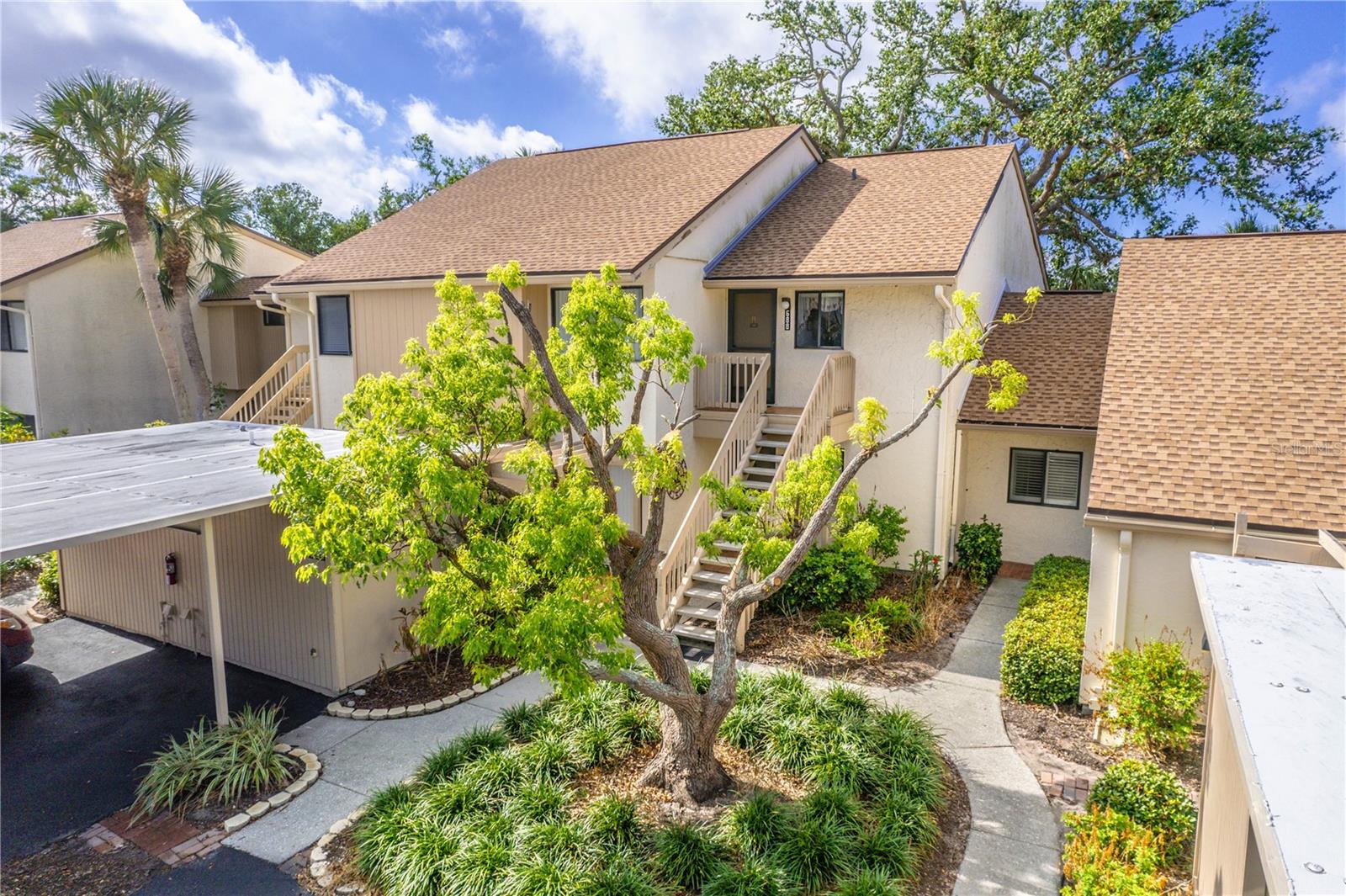 If you are seeking an ideal LOCATION and AMENITIES, then YOU found it right here! This updated partially furnished 2 bedroom 2 bathroom with an exceptional blend of style and comfort, features a spacious living and dining room combo with vaulted ceilings that opens up with hurricane impacted window sliders to your private tiled lanai nestled among the trees, and surrounding greenery offering you a serene oasis. You will love the remodeled kitchen with its beautiful cabinets, Quartz countertop and stainless steel appliances. Primary bedroom offers a large walk-in closest granite countered en-suite with a updated tile step in shower with glass doors. The second bedroom offers another slider to the lanai and full bath with tub. The large storage unit is part of the carport and has a washer / dryer with an additional water heater, counter for folding laundry with enough room to store bikes and beach chairs. BIRD BAY offers resort like amenities including tennis courts, Pickle ball courts, heated pools, fitness center, library, and plenty of social activities! Conveniently located to our beautiful area beaches, historic downtown, and the ever so popular Legacy Trail. Come see for yourself all that you can have right here at 688 Bird Bay Circle!