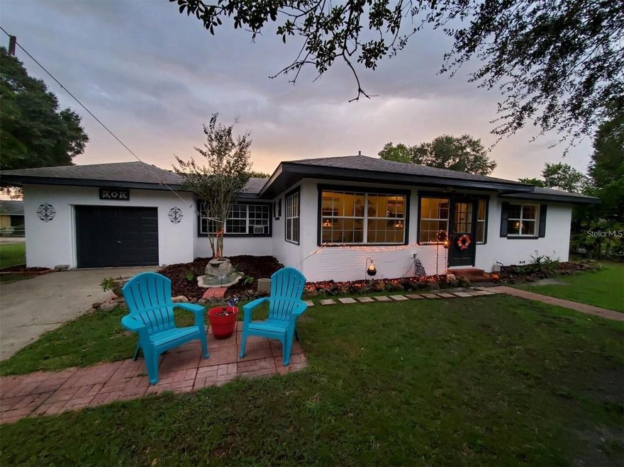 Enjoy a large corner lot home with shed and very Large yard big enough for your boat, Pool or anything else you want to have with no HOA approval needed. If you don't want a pool to maintain on your own, no worries because the park across the street has an amazing pool pictured in this listing that is only a stone throw away. This Very large 2/1 home sits on a corner double lot across the street from a skate park , the pool and a nearby lake. Hardwood floors along with beautifully rich luxury wood walls are throughout the home. An enclosed breezeway through the front door has a passageway into the kitchen for entertainment could be converted into a sitting porch or sewing room or office etc. Another enclosed breezeway between the garage and kitchen is full of windows, a backdoor, ceiling fan and light for an enjoyable craft room or extra bedroom that could be established. The property is fully enclosed with a gate bearing 2 double gates and 1 single gate. On the grounds are 1 shed in the with a single swing set. Roof: 2006 A/C: just updated last year to a larger unit. Electrical panel: early 2000. home was painted in the last two years inside and out. Washer and Dryer and extra fridge staying with property. Updated Kitchen was newly remodeled with updated appliances in the last two years. Flood lights are on all corners of the home. Buyers to verify all measurements. This is a solid base home that needs nothing but another family. Come see this property as it wont last at the current price!