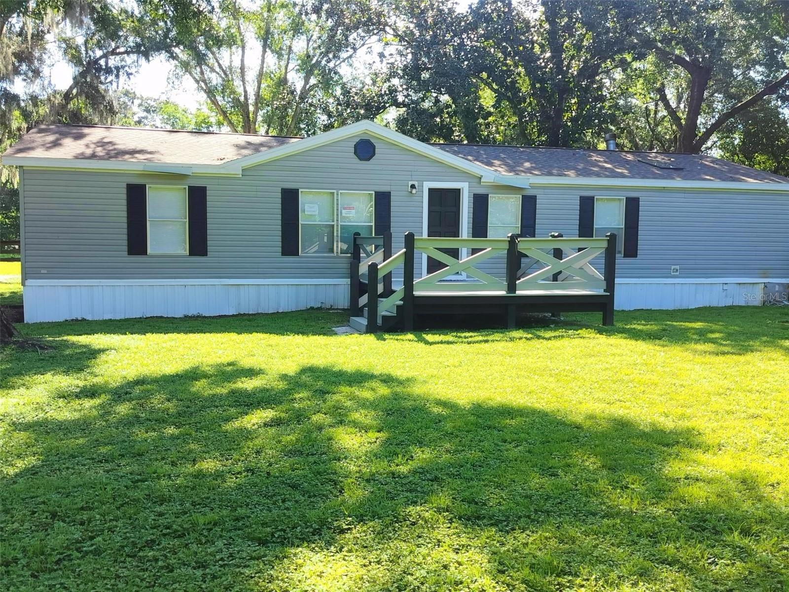 Move-in ready 3 bedroom, 2 bath home on a 1.76-acre lot is waiting for a new owner. The kitchen and baths have NEW hard surface counters, cabinets, fixtures and newer stainless appliances. NEW Luxury Vinyl Plank floors compliment the neutral color palette throughout. Nice, shaded yard with plenty of room for outdoor recreational toys. Think RV, Boat, Outdoor Kitchen. The covered patio provides room to rock, relax and rest. Major systems: Roof 2023; Drainfield 2021; HVAC 2025. Come see this one today!