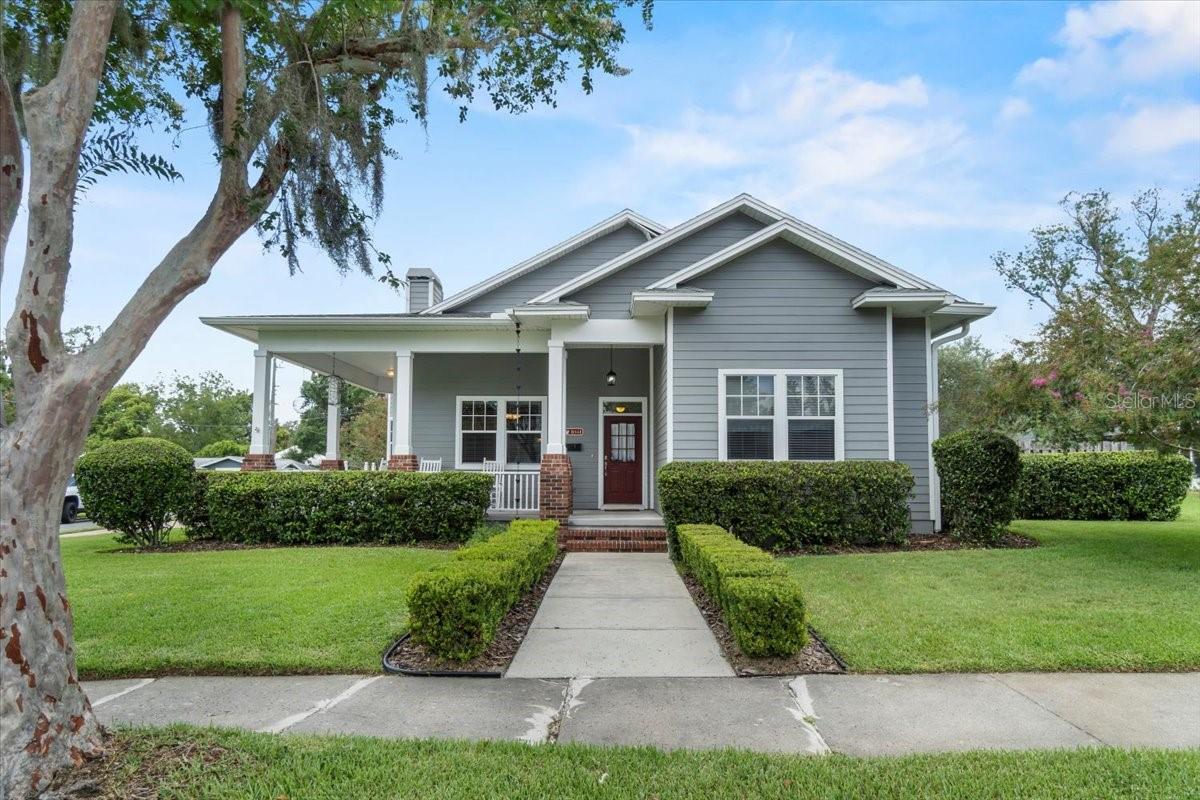 One or more photo(s) has been virtually staged. Multiple Offers, Highest and Best offer being accepted until July 23rd at 3:00PM! Location, Location, Location! Located in the heart of the charming Lake Morton Historic District and perfectly positioned between scenic Lake Hollingsworth and Lake Morton, this custom-built 3 bedroom, 2.5 bath, 2,552 sq. ft. home (built in 2003) offers timeless style, thoughtful design, and an abundance of space. ***Inside, you’ll find a beautifully functional layout featuring real wood floors, soaring ceilings, arched entryways, and elegant architectural touches like columns, crown molding, chair rails, and wainscoting. The spacious great room centers around a classic gas fireplace, while the kitchen impresses with granite countertops, stainless steel appliances (including a gas stove), wood cabinetry, a built-in wine bar, island with breakfast seating, and a cozy eat-in dinette area. ***All three bedrooms are conveniently located on the first floor, each offering dual closets for generous storage. The primary suite is a luxurious retreat with double vanities, a garden jacuzzi tub, and a large walk-in shower. Upstairs, an expansive bonus room with its own half bath provides the perfect flex space — ideal for a home office, media room, or guest suite. ***Highlights include Roof in 2017, HVAC system with 2 units replaced in 2017, and water heater in 2024*** durable Hardie board siding, a charming partial wrap-around verandah, a brick-paved circular driveway, a rear-entry two-car garage, and a covered back patio overlooking the fenced yard — perfect for relaxing or entertaining. ***All this, just minutes from downtown Lakeland’s shops, restaurants, and vibrant events. If you’re seeking a distinctive, well-appointed home in a sought-after neighborhood, this one checks all the boxes. Note: Square Footage in property appraiser's records is not accurate