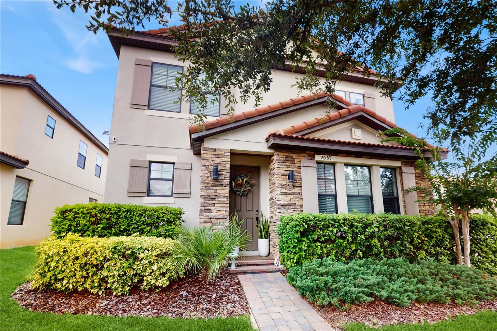Come fall in love with this home which shows better than any model home! Immediately when you enter this spacious corner lot home, you feel the care and attention to detail that has gone into every corner. Notice the new (2yr) flooring and 5 1/4" baseboards throughout, enjoy the designer wood finished accent as well as the fireplace set into a gorgeous dark wall adorned with stone imported from Germany. Here you'll also find a spacious dining area with beautiful lighting and natural light. The kitchen is spacious, has stainless steel appliances, upgraded fixtures and counters, a center island, and an eat in area. The pantry is extra large and has additional storage space. The two car garage also comes equipped with storage for you. The home has some major upgrades such as an AC System which is less than 2 years old! Additionally the water heater is only a couple of months old! The home also has a filtration system and water alkalizer. Upstairs you'll find a large loft area with an amazing built in surround sound system that stays with the home. The master bedroom is spacious and has a large walk in closet. The 3 secondary bedrooms are also located upstairs, each with built in fans and the continuation of the beautiful flooring (no carpet anywhere!). Additionally, the laundry room is located upstairs, so there's no need to move cumbersome laundry baskets up and down the stairs. Out back, you'll see that the attention to every detail continues, with the covered porch having also been finished out with wood and lighting. Enjoy the Florida weather out here with it looking good all year round, since the artificial grass keeps it green year round. The yard is fully fenced and private and features a separate covered area for your grill. This home has been planned, maintained, and loved, and it shows in every detail and upgrade. Please click on the virtual tour link in order to experience a fully interactive walk through experience.
<iframe width='853' height='480' src='https://my.matterport.com/show/?m=4nkAi9QHMYM&mls=1' frameborder='0' allowfullscreen allow='xr-spatial-tracking'></iframe>