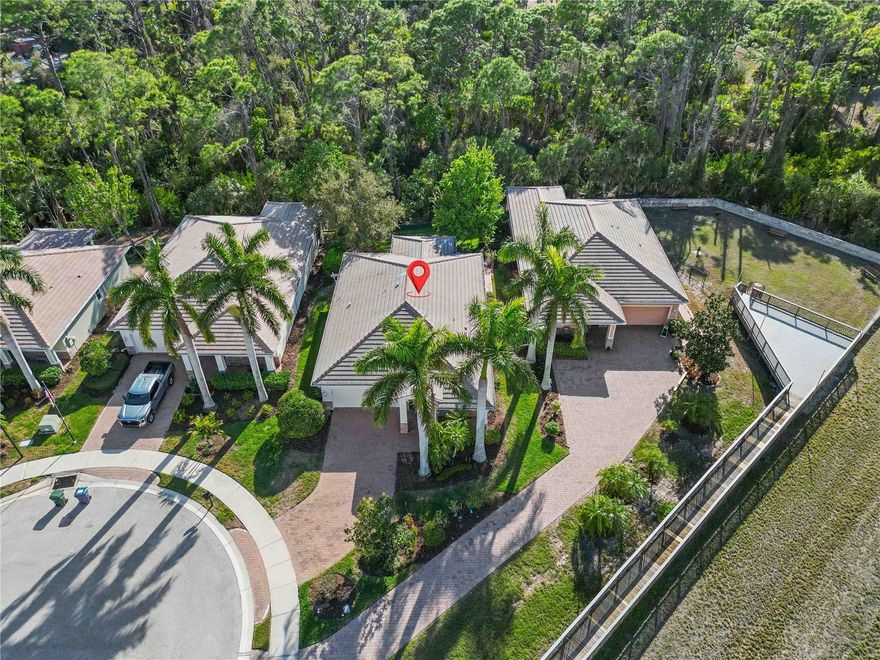 TUCKED AWAY IN A SERENE PRIVATE RETREAT, yet close to amazing Gulf beaches! Come and enjoy your own Florida escape with an extremely unique and hidden location -- overlooking nature with an abundance of trees, a creek view and the tranquility of the surrounding preserve...this is that special home that is rarely available! From the moment you pull into the brick paver driveway, you will be greeted with stylish architectural stonework and a relaxing screened front porch. As you open your front door, you’re welcomed with an expansive foyer  with tile flooring, eloquent crown molding, and a soothing color scheme leading you to the “great” room overlooking your screened lanai, private backyard and wooded retreat beyond. The “open” floor plan is ideal – showing off the beautiful kitchen with wood cabinetry, granite countertops, stylish and functional “island” – all open to your comfortable dining area where you can entertain guests and relax with a cup of coffee and your favourite book. Perfectly designed to maximize square footage, this three bedroom, “split” bedroom design, home offers all functionality and privacy for you and your guests. Unwind in a spacious owner’s bedroom, complete with updated luxury vinyl plank flooring, crown moulding, ceiling fan, generous walk-in closet, and an ensuite bathroom – providing dual sinks and roomy walk-in shower. Family and guests will be comfortable and enjoy the privacy in the 2nd and 3rd bedrooms with a shared bathroom… or turn one of the bedrooms into a home “office” area… there are lots of options! A convenient laundry room with additional cabinetry and storage closet provide added benefits, all with easy access to the 2-car garage. This home is being offered furnished so moving-in will be a breeze. But the best is yet to come! The sizable screened lanai features elevated brick paver flooring offering stunning views of your oversized backyard where you can enjoy nature and serenity any time of the day! 

The neighborhood of Heritage Creek offers a heated community pool, with convenient restrooms and a separate gated "dog park". Enjoy the savings of no CDD fees and the lawn/landscape maintenance taken care of by the HOA. Centrally located just minutes from Venice and Manasota Beach, your options of beaches, dining, quaint shops, fishing, golfing, and much more...are endless! This truly is a unique, special, and rarely found home! Don’t miss this opportunity…