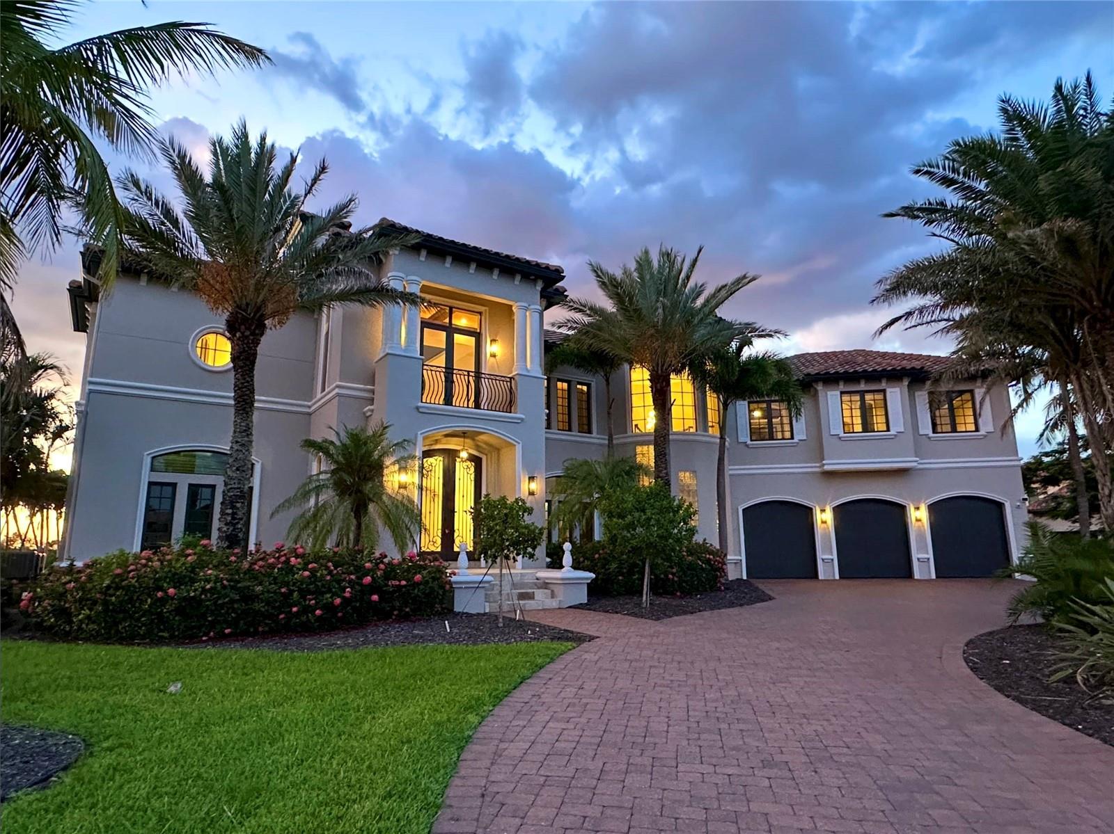 Unobstructed Tropical Views: This Sprawling Resort-Style Gulf Access Estate overlooking the direct Gulf Access South Spreader Canal. (No Flood Water Intrusion from any Hurricanes, Existing Transferable Flood Policy is approximately $1,400.00 per year). This Elegant Hurricane Proven Fortress is designed to withstand the most enduring tropical elements of Southwest Florida. A breathtaking 6,308 sq ft masterpiece that's located on a rare triple lot (.41 acres) with direct bridgeless Gulf access, offering unobstructed boating to open waters and commanding panoramic Western and Southwestern exposure sunsets that must be seen to be believed. As you arrive, you’re greeted by tropical palms, pristine landscaping, and a grand paver driveway, setting the tone for the luxury within. Step through oversized double doors into a soaring two-story grand foyer, where 20+ foot ceilings and architectural finesse welcome you home. The expansive family room features cathedral ceilings and walls of glass, framing stunning waterfront views and drawing natural light into every corner. Designed for both function and elegance, the chef’s kitchen is a showpiece — outfitted with premium appliances, a spacious center island, walk-in pantry, and abundant custom cabinetry. It's the heart of the home, ideal for everyday living and culinary entertaining alike. The primary suite is a private retreat, offering serene canal views, a luxurious spa-like ensuite bath, and a boutique-style custom walk-in closets with generous storage and display. Each of the four bedrooms and 4.5 baths is thoughtfully designed to provide privacy and comfort for both family and guests, each bedroom is set up as it's own suite, each having it's own private balcony overlooking the Spreader canal while taking in the fabulous unobstructed sunset views and mangrove landscapes. Step outside and indulge in resort-style living. The highlight of the home is a vanishing edge infinity pool that blends seamlessly into the waterfront beyond, creating a serene oasis perfect for sunset swims or relaxing under the stars. The oversized spa, soothing waterfall complete the outdoor experience. Whether hosting vibrant gatherings or enjoying a quiet glass of wine, this outdoor space is designed to impress. Additional luxuries include: Private home theater for the ultimate cinematic escape, Dedicated game room for lively entertainment, Elegant formal and casual dining areas, Smart home features and prewired surround sound, Oversized 3-car garage and ample storage throughout, Located just minutes from Cape Harbour and Tarpon Point, you’ll enjoy quick access to upscale waterfront dining, boutique shopping, and lively entertainment — all from the comfort of your own private paradise. The now lockless and bridgeless canal provides unobstructed boating access to the river and The Gulf. The Boat docks are designed to accommodate large Yachts and a boat lift for smaller craft. Don't miss this very well priced exquisite Estate Home.