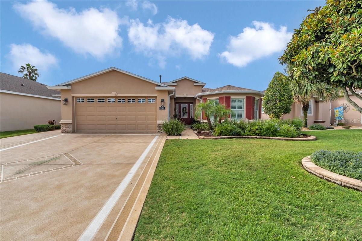 Step inside and be greeted by sweeping golf course views from the moment you open the front door. This beautifully expanded Monteverde Model II, well maintained 3 bedroom, 2.5 bath home boasts quality upgrades throughout, offering both elegance and comfort. The remodeled chef’s kitchen features quartz countertops, a matching backsplash, stainless steel appliances, a breakfast bar, and a cozy breakfast nook with panoramic views.
The spacious living room showcases stacking sliders that open to the screened lanai for seamless indoor-outdoor living, plus an additional open patio, perfect for grilling and entertaining. The master suite is a private retreat, highlighted by a fully remodeled spa style bath with a large tiled shower, built-in bench, and high end finishes. Both the master and guest bedrooms feature plush, high end carpet for added comfort, while the third bedroom doubles beautifully as an office with custom built-ins.
Additional features include plantation shutters, a surround sound system, half bath conveniently located near the kitchen and garage, a laundry sink, epoxy coated garage floors, and a dedicated golf cart garage.
Located in the sought after 55+ Summer Glen community, the HOA includes lawn mowing/edging, guard gated entry, fitness center, pool, on-site restaurant, high speed internet & TV, trash/recycling pickup, and more. Don’t miss this chance to live the Florida lifestyle at its finest!