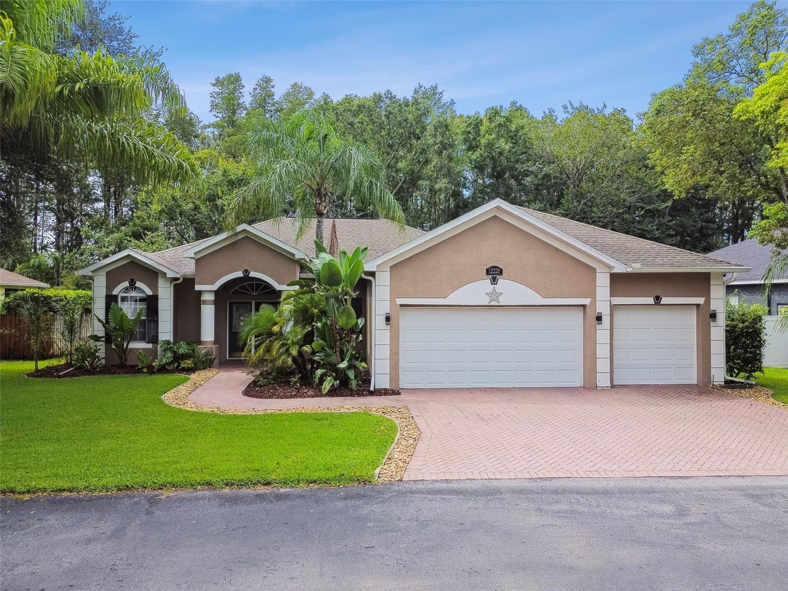 This stunning 4-bedroom, 2-bathroom home is a true tropical paradise, located in a quiet gated community just minutes from SR-52 and the Suncoast Expressway. Featuring a 3-car garage, heated pool and spa, and lush, mature tropical landscaping. Spacious split floor plan offers porcelain tile throughout, The great room opens to the enclosed lanai and pool area through triple sliding glass doors. The gourmet kitchen features granite countertops, a large pantry, stainless steel appliances, oak cabinetry, and a breakfast bar overlooking the great room.The luxurious master suite includes a custom walk-in closet organizer and an en-suite bathroom with his-and-her vanities, granite countertops, a soaking tub, and a large walk-in shower. The pool and spa come equipped with an automatic pool cleaner, a chlorine generator that uses salt for a cleaner, safer swimming experience. Recent upgrades include a new roof and A/C in 2020 and a hot water heater in 2023, please see the attached full list of upgrades. Additionally, select items such as security cameras, TVs, and office furniture can be included in the sale for an additional price. This home offers the perfect blend of style, comfort, and convenience – a must-see for anyone looking for their dream home.