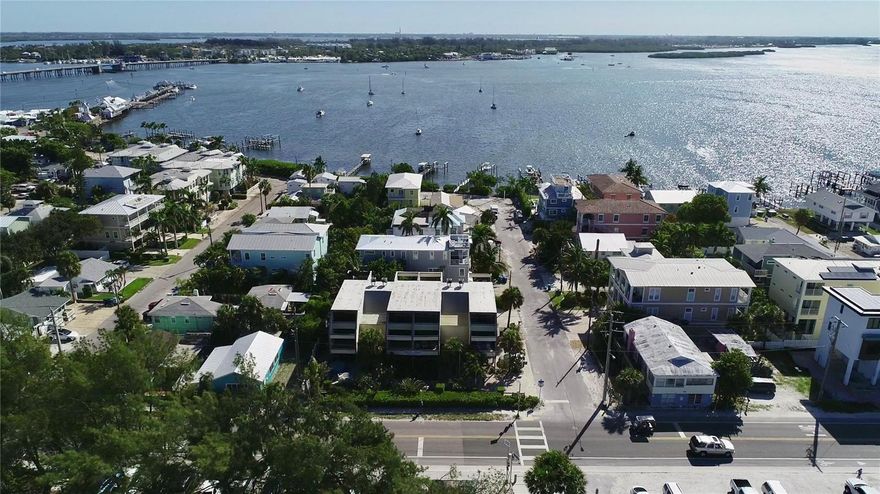 Calling all investors! Here is your chance to own a piece of paradise. This property is a DOUBLE lot with Gulf Views situated on Gulf Drive just two blocks away from Historic Bridge Street where you will find shopping, restaurants, coffee shops and more. Four townhomes are currently situated on the property with two being used as seasonal rentals. One end unit sustained fire damage coming from exterior rear balcony no structural damage found and engineering plans are available. Fix up the current building or tear down and start from scratch the choice is yours. This double lot is the only currently available corner lot on Bradenton Beach with direct gulf views. Be a part of one of the fastest growing beach communities in the nation!