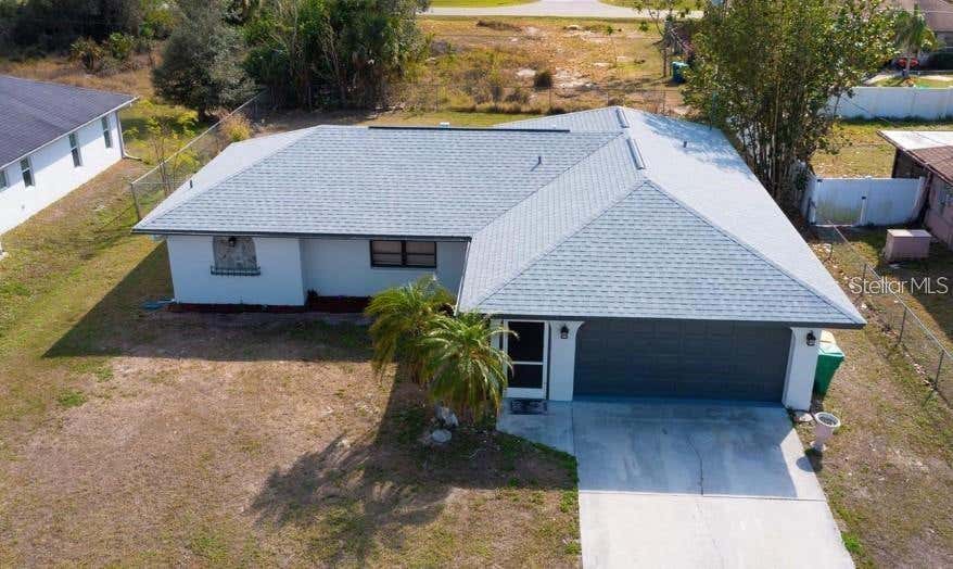 Well-kept Port Charlotte home featuring an open living area, bright kitchen, and comfortable bedrooms. Spacious yard offers room to relax or add future outdoor features. Conveniently located near shopping, dining, parks, and Gulf Coast beaches.