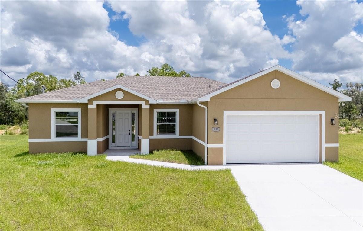 MOVE IN READY - CUSTOM BUILT - NEW CONSTRUCTION. The Hampton model stands out among Lehigh's current construction offerings, featuring 3 bedrooms, 2 bathrooms, a DEN, and an oversized garage. Pie shaped .34 ACRE LOT offers a HUGE BACKYARD. Neutral colors, 10 ft. high ceilings, 8ft. doors and TILE FLOORING THROUGHOUT (no carpet). Light and bright upgraded kitchen with Moen fixtures, GRANITE countertops, soft close shaker cabinets, BIG PANTRY and stainless steel appliances. The primary bathroom includes dual sinks, a BATHTUB, and a WALK-IN shower, while spacious WALK-IN closets can be found in the bedrooms. LOCATED IN FLOOD ZONE "X', SO NO FLOOD INSURANCE REQUIRED.