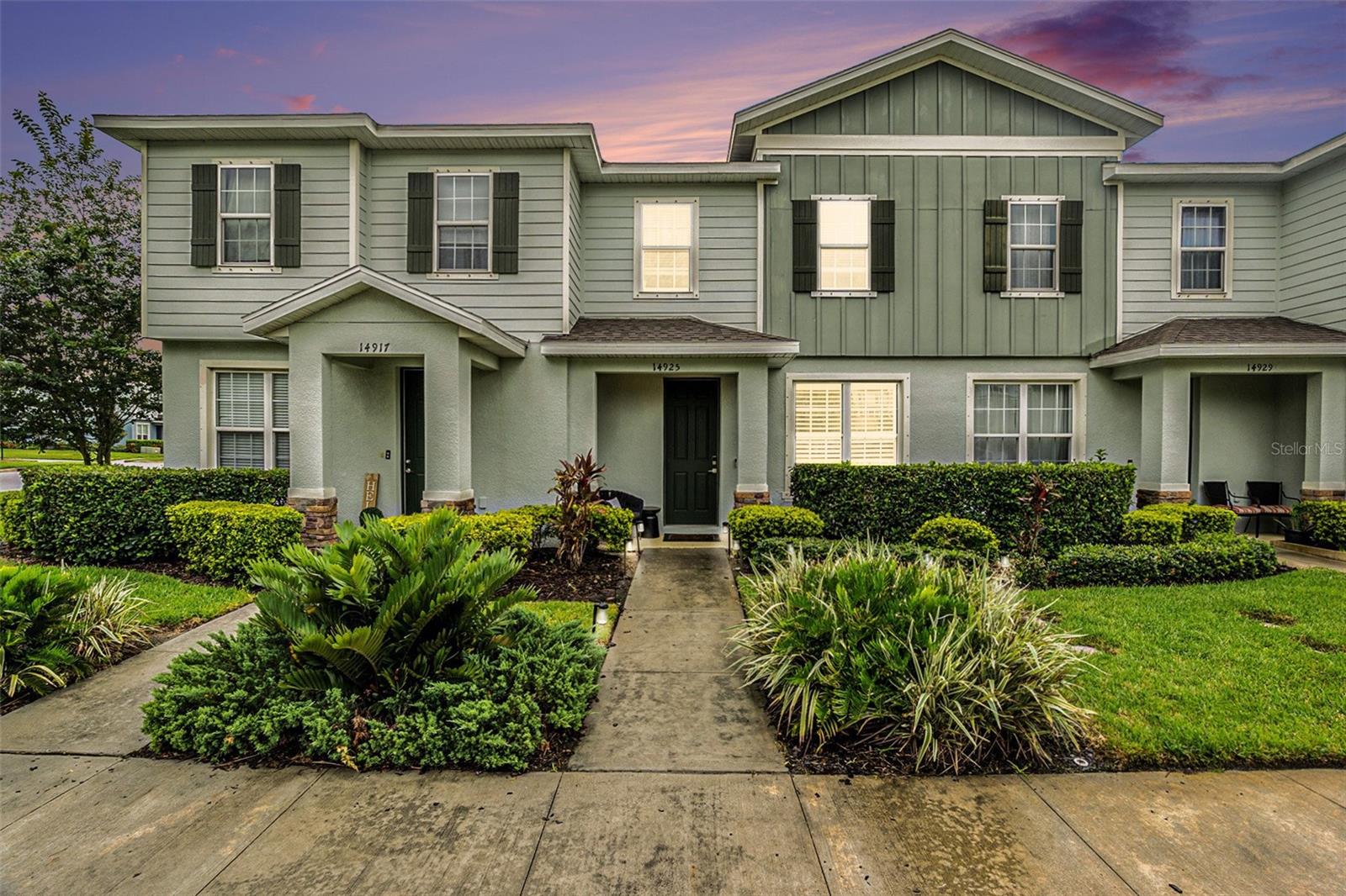 Welcome to 14925 Promenade Parkway, a beautifully upgraded townhome located in the highly sought-after Asturia community of Odessa, Florida. This two-story gem features 3 bedrooms, 2.5 bathrooms, and an open-concept layout that effortlessly blends modern style with everyday functionality.
Step inside to a light-filled interior with rich wood-style flooring, designer light fixtures, and upscale finishes throughout. The gourmet kitchen is a true standout, boasting granite countertops, 42-inch espresso cabinetry, stainless steel appliances, a walk-in pantry, and an oversized center island perfect for cooking, entertaining, or casual dining.
The spacious living and dining areas flow seamlessly, ideal for hosting family and friends. A convenient powder bath on the main level adds extra functionality. Upstairs, the owner’s suite offers plush carpeting, a walk-in closet, and an elegant en-suite bath with dual vanities, solid surface counters, and a beautifully tiled walk-in shower. Two additional bedrooms, a full guest bath, and a dedicated laundry room with high-efficiency washer and dryer complete the upper level.
But the best part—according to the sellers—is the location. This townhome sits directly across from Asturia’s top-notch amenities, including the resort-style pool, clubhouse, and fitness center. Enjoy peaceful views of the community lake and fountain right from your front windows. Out back, a fully fenced, oversized private patio with brick pavers and garden beds is perfect for summer BBQs or relaxing under the string lights. Just beyond, a detached two-car garage provides ample storage and secure parking.
Living in Asturia means access to a vibrant community with zero-entry pool, modern fitness center, playgrounds, dog parks, walking trails, and beautifully maintained green spaces. The HOA covers exterior landscaping, making life here truly low-maintenance.
Zoned for top-rated Pasco County schools and ideally situated just off SR-54 with quick access to the Veterans Expressway, this home offers an easy commute to downtown Tampa, Tampa International Airport, and the Westshore business district. You’ll also be minutes from popular spots like Starkey Market, Tampa Premium Outlets, The Shops at Wiregrass, and Citrus Park Town Center. Healthcare facilities such as HCA Florida Trinity Hospital, BayCare HealthHub, and AdventHealth Central Pasco ER are nearby for added peace of mind.
Don’t miss your chance to own this move-in-ready, ideally located home in one of Odessa’s most desirable neighborhoods. Schedule your private tour today!