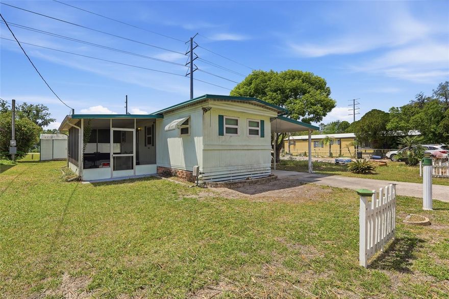 NO HOA — OWN YOUR OWN LAND! Welcome to this 2-bedroom, 1-bath home located in desirable Zephyrhills, offering an excellent opportunity for full-living, seasonal use, or investment. This partially furnished home features a full-length carport, a spacious 10x20 screened-in porch, and two storage sheds with electricity—perfect for a workshop, hobby space, or additional storage. The windows have been updated within the last eight years, adding value and efficiency. A metal roof-over provides added durability and protection.
Situated on your own land with no HOA restrictions, this property gives you the freedom to make it your own. While it does need some TLC, it presents a great opportunity to customize and add value. Conveniently located near shopping, dining, and everyday amenities.
Don’t miss your chance to own an affordable Florida property with great potential—schedule your showing today!