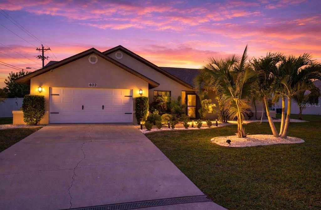 Photo of 402 SW 37th Lane, Cape Coral, FL 33914 (MLS # C7525571)