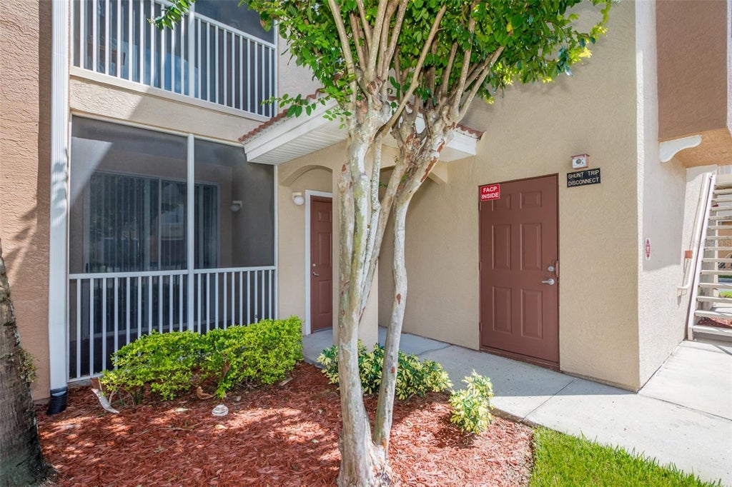 Photo of 12110 Poppy Field Lane #103, Orlando, FL 32837 (MLS # O6442110)