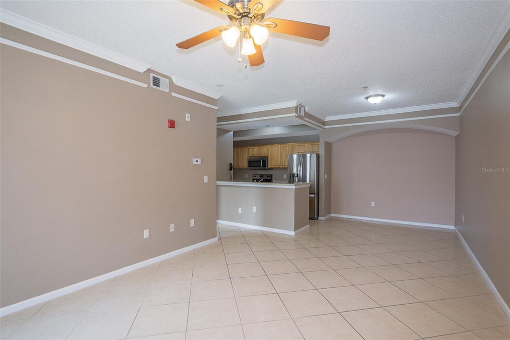Photo of 12110 Poppy Field Lane #103, Orlando, FL 32837 (MLS # O6442110)