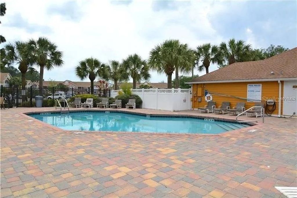 Photo of 2456 Sweetwater Club Circle #20, Kissimmee, FL 34746 (MLS # O6403343)