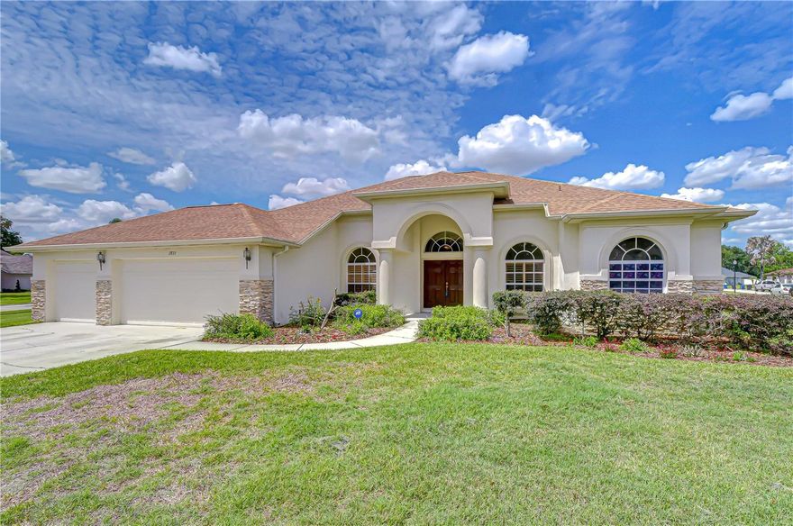 Opportunities like this simply do not come along often. Nestled on a breathtaking .45-acre peninsula-style lot in one of Valrico's most sought-after communities, this Twin Lakes treasure offers an extraordinary combination of rare land, resort-style outdoor living, and a warm, gracious floor plan that has stood the test of time. The way the home rests at the curve of the road creates effortless curb appeal, complete with a charming circular driveway and lush tropical landscaping that sets the tone the moment you arrive. Added peace of mind comes with a roof replaced just five years ago, a pool resurfaced five years ago, and freshly painted kitchen cabinets — so the big-ticket items are already handled and you can simply move in and make it your own. Inside, hardwood floors, neutral tones, and an abundance of natural light pour through the home, giving it a timeless warmth and an easy, flowing layout that works beautifully for both everyday living and entertaining. The home is also wired for surround sound throughout. A private office with plantation shutters sits quietly at the front of the home near the primary suite — ideal for working from home or a reading retreat. The primary suite is a true sanctuary, featuring sliding glass doors to the lanai, dual walk-in closets, and a spa-inspired en suite bath complete with dual vanities, a soaking tub, and a walk-in shower. The kitchen truly feels like the heart of the home, outfitted with freshly painted white cabinetry, stone countertops, stainless steel appliances, a breakfast bar, and a pantry. A sunny breakfast nook with an oversized window frames beautiful pool views and fills the space with light. The family room impresses with soaring vaulted ceilings and built-in shelving, while sliding doors open to the screened lanai and beyond. The living and dining rooms flow naturally together, each with sliders connecting to the outdoors. All bedrooms are generously sized — two share a Jack-and-Jill bath, and a fourth enjoys easy access to a nearby bath that doubles perfectly as a pool bath. At the rear of the home, a spacious bonus room with a tray ceiling and direct pool access is ready to become whatever you need it to be. Step outside and the yard truly takes your breath away. The sparkling pool features a sun-shelf entry and is framed by lush tropical landscaping and a beautiful rock feature — all set within a fully fenced yard of remarkable scale that is almost unheard of in today's market. Whether you're entertaining a crowd or simply unwinding in your own private oasis, this outdoor space delivers a resort lifestyle every single day. And the lifestyle extends beyond your own backyard — Twin Lakes residents enjoy a community pool and an 11-acre park, all just minutes from major shopping, top-rated schools, and convenient commuter routes. This is a rare chance to plant roots in one of Valrico's most desirable neighborhoods on a lot that simply cannot be replicated.