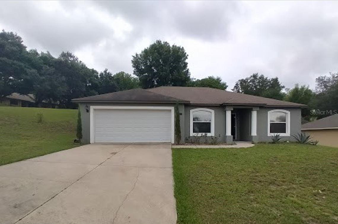 Discover this beautifully upgraded three-bedroom, two-bathroom corner-lot home in Clermont, complete with a spacious double-car garage. From the moment you walk through the door, you’ll be greeted by an open, light-filled interior that feels both welcoming and stylish. The upgraded kitchen is a true highlight, featuring stainless steel appliances, granite countertops, and a cozy breakfast nook with direct access to the garage.
The split floor plan is designed for comfort and privacy. On one side of the home, you’ll find two bedrooms and a guest bathroom, while the primary suite sits just off the living room. The primary suite offers a spacious walk-in closet and private bathroom, creating the perfect retreat. Sliding glass doors from the living room open into the backyard, providing a seamless indoor-outdoor flow for entertaining or relaxing.
Perfectly located near Clermont’s Waterfront Park, Lake Minneola boat ramp, and the South Lake Trail, this home combines upgraded finishes, functional design, and an ideal location. Don’t miss the chance to make it your, call today to schedule your private tour!