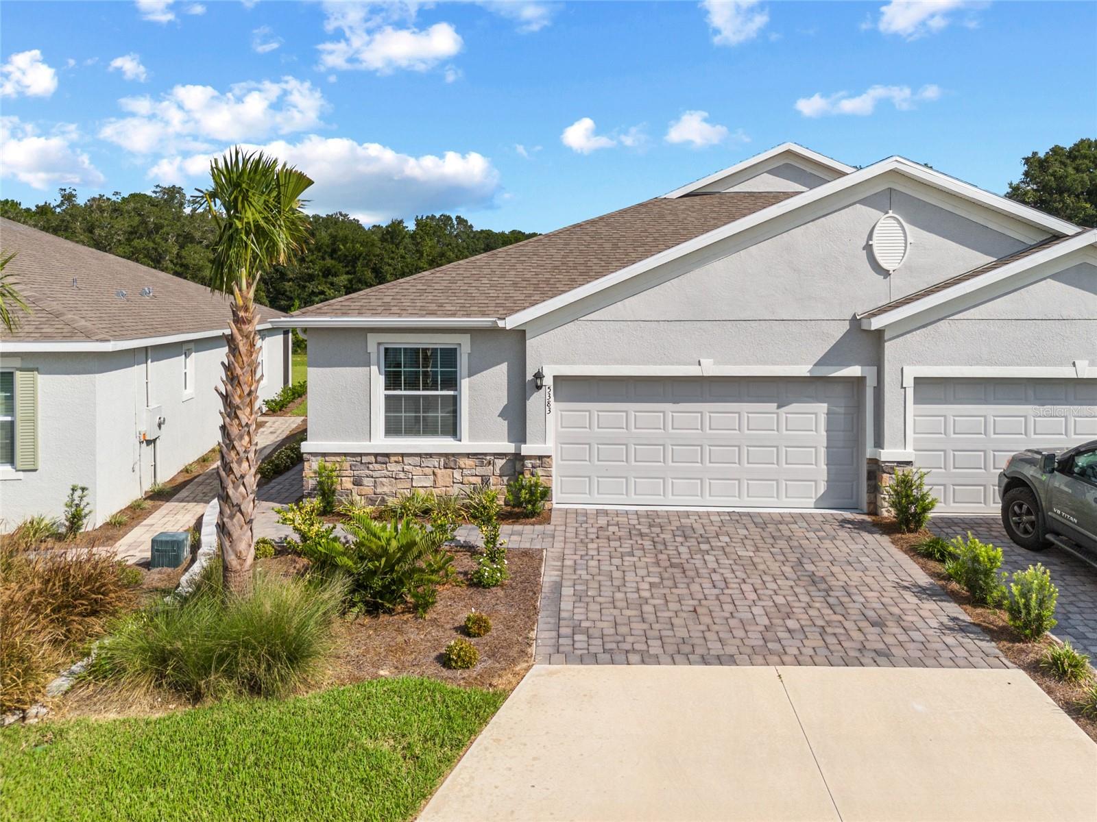 Start enjoying luxury living at the prestigious Ocala Preserve gated community, located minutes to The World Equestrian Center! This FULLY FURNISHED Villa is immaculate, tastefully decorated and turnkey! Featuring 2 bedrooms, 2 bathrooms, plus office/den with walk-in closet and privacy doors (optional 3rd bedroom) and a 2-car garage. With over 1,541 square feet of open floor plan and modern living, the perfect blend of luxury and comfort, in a light and airy atmosphere. Located in the non-age restricted phase of Ocala Preserve! Less than a year old! All the updates you want when you move into a newly built home have already been done for you! Step inside to tall ceilings, natural light, and an open floor plan that flows effortlessly into an expansive open-concept great room. At the heart of the home is a stunning chef's kitchen, featuring an oversized kitchen island, glistening granite countertops, solid wood cabinetry, new stainless steel appliances, task lighting and a custom built shelves for added storage space. The center island has breakfast bar seating and an additional dining room table is just off the kitchen. A great room, with living and dining space, looks out over the spacious lanai featuring beautiful backyard views, with NO REAR NEIGHBORS! Adjacent, a set of French doors offers privacy in the office/den, or optional flex space equipped with a large walk-in closet. A primary suite, featuring a gorgeous ensuite bathroom, king bedroom suite and large walk-in closet is warm and inviting. Its personal bath features neutral cabinetry with quartz, double sinks, a walk-in shower with a tile surround and glass doors, plus a water closet for privacy. The second bedroom is nearby a well-appointed guest bath and the interior laundry closet, which is equipped with a brand new washer and dryer and built-in shelving. Fantastic curb appeal is one of the many things you will notice about this premium villa lot located in this premier resort-style community! The oversized backyard looks out to one of the many walking-trails with no construction on the street. This model sits at the back of the neighborhood for extra tranquility. Amongst many upgrades are PAID IN FULL SOLAR PANELS! From its luxurious upgrades to its attention to detail, this home is a rare find that perfectly blends sophistication with comfort. The HOA fee covers lawn and landscape maintenance, high-speed fiber optics internet, and membership access to all community amenities. These include both indoor and outdoor fitness areas, group fitness classes, 21 miles of dedicated walking and biking trails, bocce, horseshoe pits, tennis, pickleball, a fishing dock, kayaks, canoes, and a paddleboat. Not to mention the clubhouse, the 18-hole Tom Lehman-designed golf course, Salted Brick restaurant and day spa.