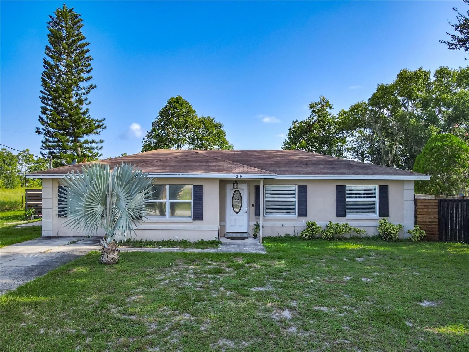 POOL HOME WITH NO HOA!! This 4 bedroom / 2 bath home features upgrades such as ceramic tile throughout, granite countertops in the kitchen, newer appliances, mounted TV's and ceiling fans in the bedrooms. The primary bedroom has an ensuite bathroom with a walk-in shower, 3 additional rooms share a bathroom with a tub, and it has separate living and dining areas. The home is rounded out by a convenient indoor laundry room with included washer and dryer plus storage space, and a large covered lanai leading to the relaxing pool, perfect for entertaining! Bring your toys, trailer, business truck, boat, etc. with no worries about restrictions. Pets welcome! Located right down the street from peaceful Lake Mariana which is great for fishing and has a public boat ramp, only 8 minutes from I-4, Publix, and close to shopping, restaurants, Legoland, Disney and other attractions. Pool and grounds maintenance included! Furnishings optional. Seize this opportunity today!