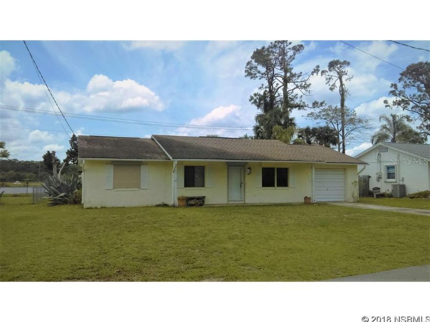 CB home nestled on a pond front property with great views of the water. Relax and enjoy the water breeze from the large backyard with plenty of room for a new pool. This listing features 2 Bedroom, 2 Full Baths, 1 car garage, front and back porch, large size family room with plenty of space to convert 1/2 of the space into another bedroom. Large open kitchen with a breakfast-bar, dining room, inside laundry room, good size living room, manual roll-down hurricane shutters, Roof replaced in 2009 and A/C installed in 2016.  Quiet neighborhood with great neighbors! ;Water: City