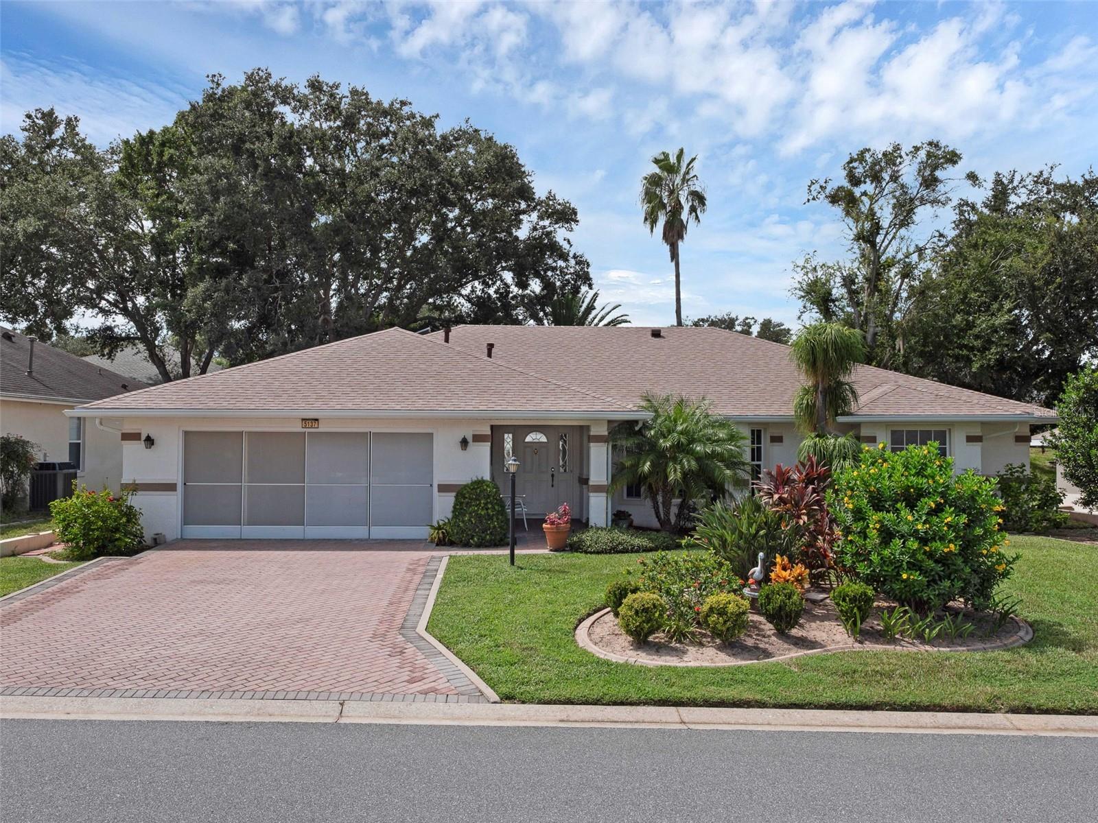 Find your way to this expanded Princess Model saltwater pool home! Situated in the heart of Royal Highlands, a 55+ gated, golf community with on-campus restaurant and tons of amenities. Upon arrival, you'll adore the lush landscaping and covered entry. Inside, you'll find both formal and casual living and dining areas, split bedroom floor plan, ample closets and storage, as well as a large screened patio with heated pool! Offering three full bedrooms, two bathrooms, inside laundry room, and nearly 2200 square feet of under air living! The kitchen has a pass-through to the pool deck, pull-outs in lower cabinets, black/stainless appliances, and the perfect pantry! The primary suite provides it's owners with a walk-in closet, soaker tub, step-in shower, and dual vanity. The living room has bamboo flooring, vaulted ceilings and you'll find skylights, sliders, arched windows, and views of the pool from many rooms! Come see what Central Florida living is all about! Close to amusements, MCO, turnpike, shopping and restaurants. We look forward to your showing! 2024 Roof!