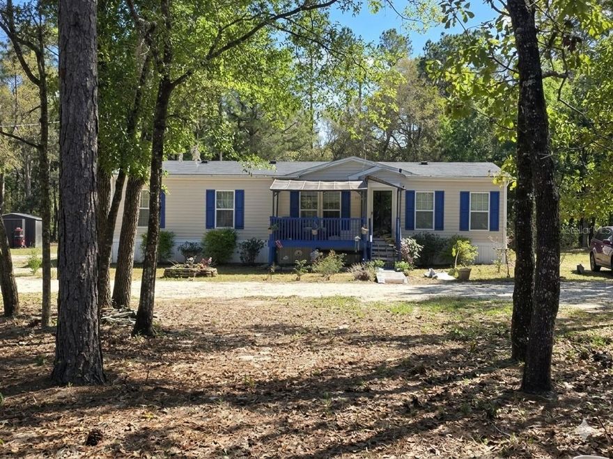 Escape the noise and discover your own private retreat.This welcoming and well cared for 2021 double-wide 1560 sqft 4 bedrooms and 2 full bathroom sits on a 2.50 acre lot and is ready for its next chapter! From the home to the land, everything has been kept in excellent condition.
Whether you dream of cultivating a garden, raising chickens, or simply enjoying open land without neighbors right on top of you, this property invites you to live closer to nature. The front deck is the perfect place to start and end your day in peace.
Inside, the home features a desirable split floor plan that provides both privacy and functionality. The kitchen is equipped with stainless steel appliances, ample cabinetry, and a convenient breakfast bar ideal for casual dining or entertaining. The ensuite bathroom includes tub, ample cabinet space, a walk-in shower, and a double vanity, creating a relaxing and well-designed retreat. 
Located in the quiet, friendly community of Bronson. You’ll enjoy quick access to nearby schools and major roadways while still getting the privacy and serenity of a countryside setting —all without the urban hustle. Multiple outdoor living zones, creating comfortable spaces for relaxation and entertaining. Ideal for full-time living, a second home, or a private Florida retreat. This property blends comfort, space and country living. Come see all it has to show! Schedule your showing today!