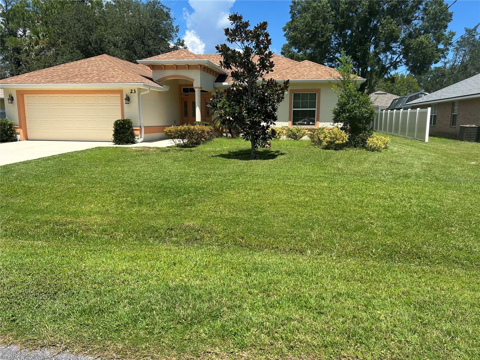 Welcome to the beautiful rental home on 23 Pineash Ln! This is a fully fenced, with a spacious covered & screened porch for an additional privacy in the backyard house with no carpet inside. A 3/2/2, 2018 built as a highly energy- efficient, WITH IMPROVED INDOOR AIR QUALITY, virtually allergen-free, a Certified Green Home, Certified Energy Star Home. Open floor plan features, a large kitchen island with stainless steel appliances & a microwave vented outside in a kitchen which overlooks dining & living space making it great for entertaining friends & family. Light & airy master suite with double sinks in the master bathroom, a large tiled shower with an elegant shower door, and a walking closet with an entry to the bedroom. This house features high & tray ceilings, laminate & tile flooring, luxury gourmet kitchen, genuine wood cabinets & granite countertops, ceiling fans in each room, energy efficient low-e windows & much more, elevate this already comfortable & cozy home. Enjoy the outdoors with a covered screened porch, fully fenced backyard, and indoor privacy with a popular split floor plan. Located in a peaceful desirable Pine Grove subdivision. Save money, live healthy, feel safely by renting the house on 23 Pineash Lane. Call L/A for a private showing. Proof of income required.