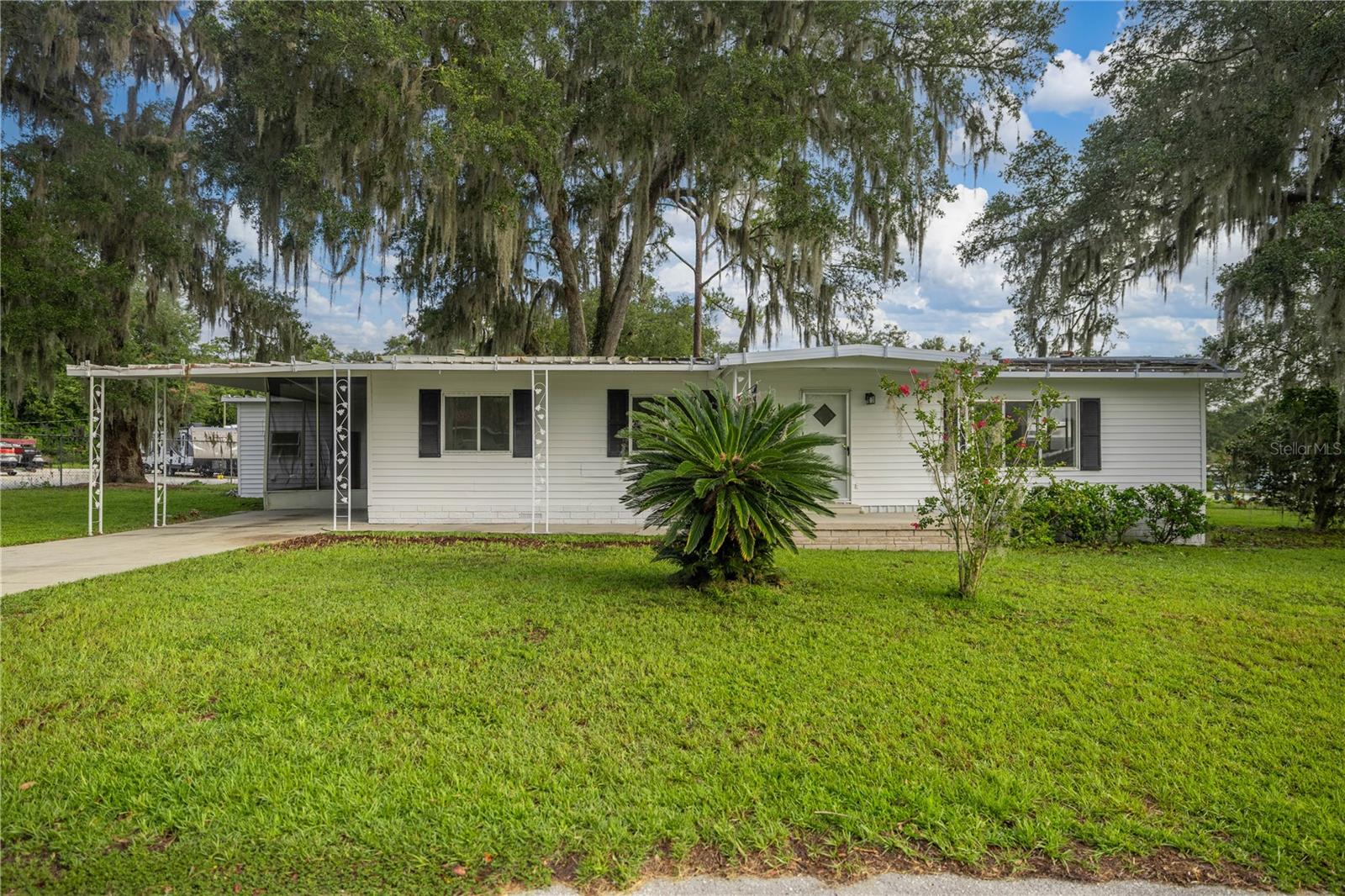 OWNER FINANCING AVAILABLE! NO LOT RENT! Welcome to this fully renovated 2 bedroom 2 bathroom home on a 0.27 acre corner lot in the no age restricted Ocala East Villas Community. Very affordable HOA of just $150 a month, which includes water, sewer, trash, yard waste and recycling pick-up, use of clubhouse, pool, fitness center, and library. As you walk in you will notice an expansive living room and a nice open concept kitchen with brand new luxury vinyl flooring throughout. All new stainless steel appliances along with updated countertops makes this a chefs dream. Brand new interior and exterior paint as well as fully updated bathrooms. Enjoy your morning cup of coffee with the attached Florida room. A 2025 Central AC Unit gives a peace of mind to the new homeowner for years to come. Call today to make it yours!