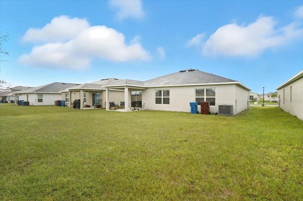 Photo of 232 Summerlin Loop, Haines City, FL 33844 (MLS # P4936599)