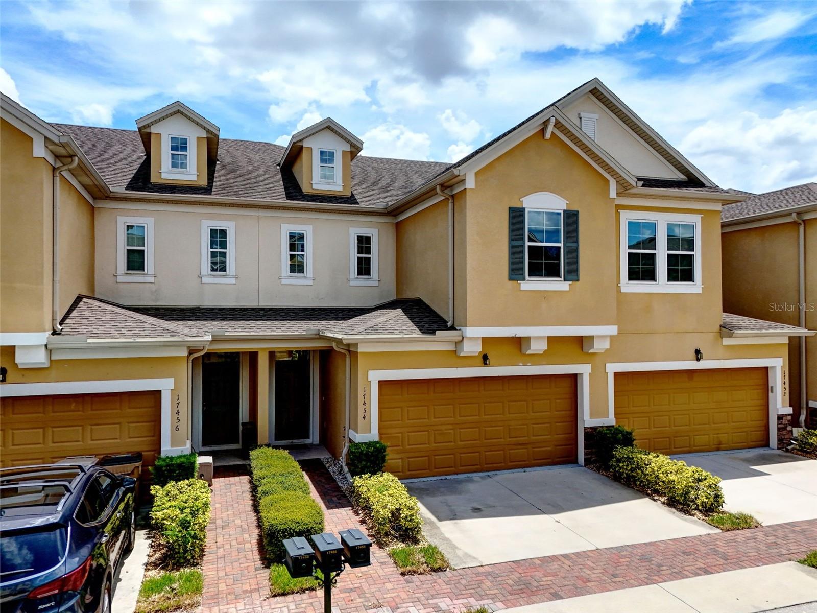One or more photo(s) has been virtually staged. Welcome to affordable luxury in the highly sought-after, 24-hour guard-gated community of Magnolia Pointe! 17454 Chateau Pine Way is a nearly new 4-bedroom, 2.5-bath townhouse offering over 2,000 square feet of thoughtfully designed living space, including a rare primary suite on the main floor, an expansive upstairs loft, a covered lanai and a full 2-car garage. From the moment you arrive, you’ll appreciate the clean lines, elegant finishes, and pride of ownership throughout. The spacious kitchen features granite countertops, stainless steel appliances, and updated fixtures, blending modern design with functionality. All four bedrooms are generously sized—perfect for families, guests, or a home office setup.
Step outside your front door and into a resort-style lifestyle. Magnolia Pointe is perched on Johns Lake, a 2,580-acre lake where residents enjoy private access to the community boat ramp and dock; ideal for boating, fishing, water skiing, jet skiing, tubing or just drifting! The community also offers a clubhouse, gym, community pool, tennis courts, basketball hoops, a playground, and a lakeside park, making it the perfect setting for active living and family fun.
Whether you’re looking for a serene place to unwind or a vibrant neighborhood to explore the outdoors, this home delivers it all. Don’t miss your chance to live in one of Lake County’s premier waterfront communities! Schedule your private showing today!