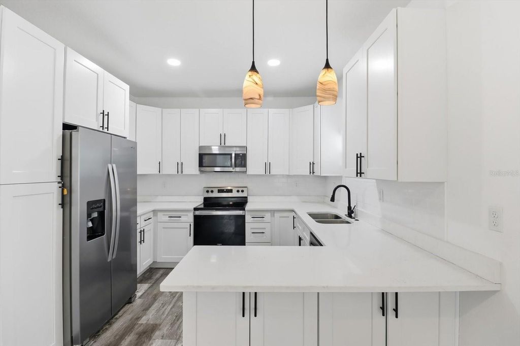 Photo of 3902 N Suwanee Avenue, Tampa, FL 33603 (MLS # OM714228)