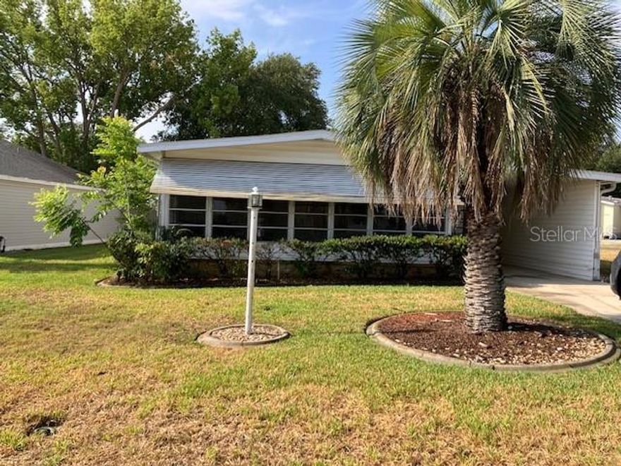 PRICE ADJUSTMENT!! Welcome to this 2-bedroom, 2-bath manufactured home nestled in the heart of The Villages, Fl.  This inviting residence offers comfortable living with a spacious enclosed Florida room, perfect for relaxing or entertaining year-round.
Enjoy the convenience of a covered carport with an attached storage area, ideal for tools, or hobby space. Inside, you’ll find an open floor plan with a cozy living area, functional kitchen, and a dining space. Both bedrooms are generously sized, and the primary suite features its own private bath.
Located in a quiet, friendly neighborhood just minutes from shopping, dining, golf courses, recreation centers, and all the amazing amenities The Villages is known for.
Amenity fee is $199 a month. There is no Bond or CDD.  Nice location close to Spanish Springs Square where you have nightly entertainment, dining and dancing which is golf cart accessible along with just off 441/27 which has shopping, dining and banking.