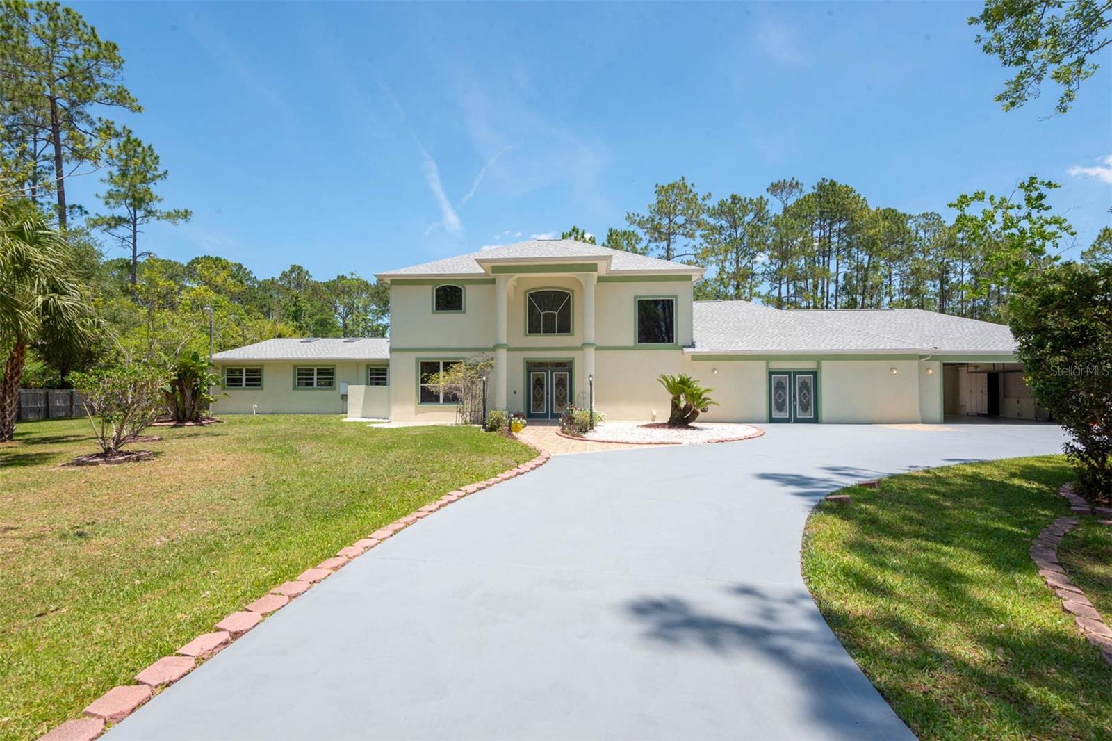 Move-in ready home located in a gated community in Ormond Beach on over an acre of land. This property offers 3 bedrooms, 4 bathrooms, and over 4,300 square feet of interior living space. Features include an indoor pool and spa, a soundproof theater room with a whole-home surround system, and a flexible layout with space that can be used as a home office, game room, or for multigenerational living.
Recent updates include a new roof, new 80-gallon electric water heater, new fountain pump, four new exterior wall lights, repainted storage shed, and a newly finished garage floor. The double garage doors provide easy access for larger vehicles or equipment. Property includes a full driveway and additional space for RV or boat parking. Private tours available by appointment.