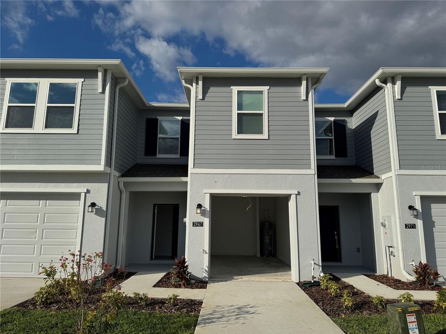 Welcome to your brand-new home at 2967 Maloof Drive, Davenport, FL!
This stunning two-story townhome, built in 2025, is located in the beautiful and growing Brentwood community. Offering approximately 1,787 square feet of modern living space, this residence perfectly combines new construction quality, stylish design, and a convenient location just minutes away from shopping, dining, and world-class attractions.
Step inside and immediately feel the spacious and bright open-concept layout that seamlessly connects the living room, dining area, and kitchen. The modern kitchen is equipped with elegant finishes, ample cabinetry, and a large island ideal for casual meals or entertaining guests. The open plan creates an inviting atmosphere perfect for family gatherings or relaxing evenings at home. Sliding glass doors lead to a private covered patio, offering a perfect spot to enjoy Florida’s warm weather and peaceful sunsets.
Upstairs, you’ll find a flexible loft area that can serve as a home office, playroom, media space, or additional lounge. The two secondary bedrooms are spacious and bright, sharing a well-appointed bathroom. The primary suite is your private retreat — featuring a generous layout, a large walk-in closet, and a luxurious en-suite bath designed for relaxation. Every detail in this home reflects modern comfort and thoughtful design, from the open flow of the living areas to the serene ambiance of the bedrooms.
The Brentwood community provides a resort-style living experience with amenities designed to enrich your lifestyle. Residents enjoy access to a sparkling swimming pool, playground, and clubhouse, offering opportunities for recreation, fitness, and socializing. Whether you’re enjoying a weekend by the pool or meeting neighbors for a community event, Brentwood offers the perfect blend of leisure and convenience.
Location, location, location! This home is ideally situated close to everything you need. Within just 5 minutes, you’ll find a Walmart Supercenter for groceries and everyday essentials. About 8 minutes away is Target, along with other popular shopping and dining options. For those who love adventure and entertainment, you’ll be delighted to know that Walt Disney World Resort is only about 20 minutes away, giving you quick access to world-famous theme parks, restaurants, and attractions. The property is also conveniently located near Highway 27 and Interstate 4, making commuting to Orlando, Tampa, or surrounding areas simple and efficient.
This unbeatable location allows you to enjoy the tranquility of suburban living while staying close to major employment centers, entertainment venues, and shopping districts. It’s the perfect combination for those seeking both relaxation and accessibility.
With its brand-new construction, stylish design, and excellent proximity to shopping and attractions, this property is a fantastic choice for families, professionals, or investors. Whether you’re looking for your first home, a vacation retreat, or a low-maintenance investment property, 2967 Maloof Drive offers everything you could want — comfort, quality, and convenience in one of Davenport’s most desirable new communities.
Don’t miss your chance to own this exceptional home. Schedule your private showing today and discover the modern Florida lifestyle waiting for you in Brentwood at Davenport — where everyday living feels like a vacation.