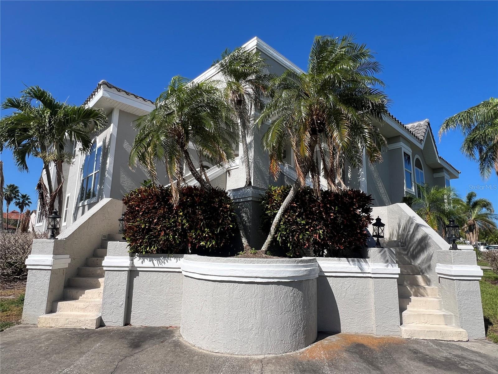 Extremely spacious and beautiful single family home in Tierra Verde! This multi-floor home features a three/four car garage plus plenty of room for toys and storage. The lower-level laundry is tucked conveniently out of the way. Enter the main living area hosting a formal dining room and formal living room with French doors leading to the upper pool deck. Your family will enjoy this updated Chef's Island Kitchen with custom cabinets, granite counter tops, large breakfast bar, a pool view breakfast nook and top of the line appliances. Relax with the gang in your large family room featuring custom built-in bookcases, a fireplace, a coffee bar and large slider leading to the pool area. The upper level features the primary suite with ensuite bath. More upper deck access gives stunning sunset views. A den/office and two additional bedrooms make up the main living area. Don't miss this opportunity to own a piece of paradise.