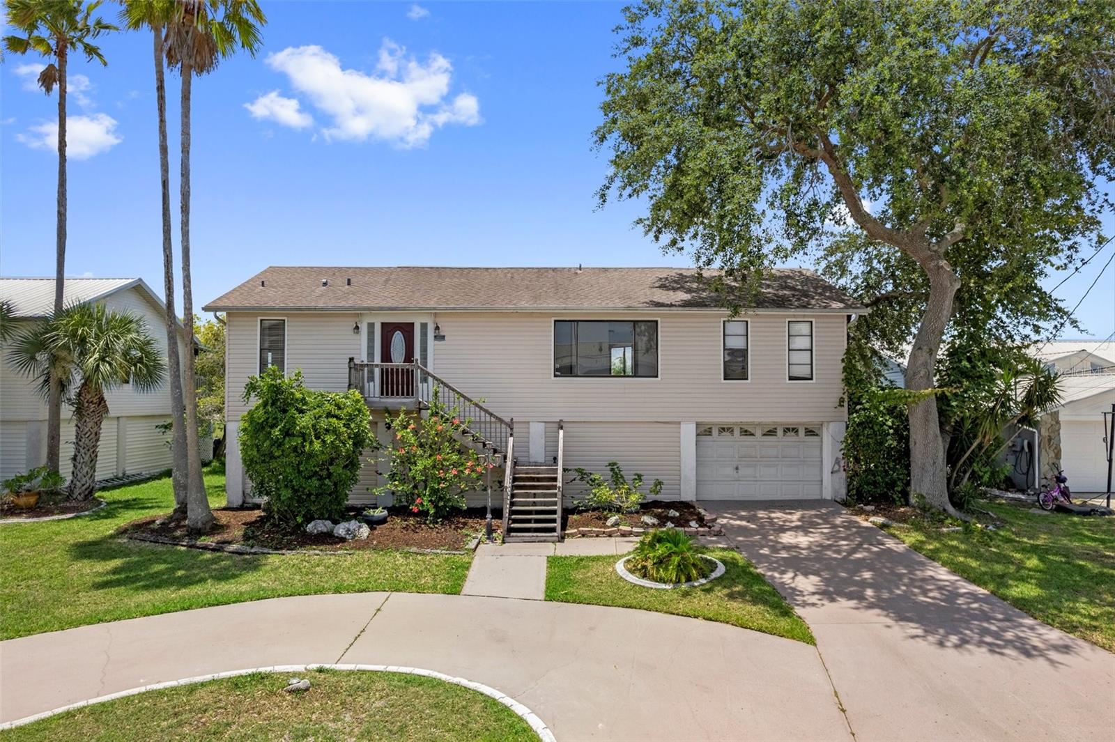 One or more photo(s) has been virtually staged. HERNANDO BEACH STILT HOME UNDER $400K! BRING YOUR VISION & OFFER! This is it the ONLY stilted 2 story home currently available in Hernando Beach under $400,000! Waterfront with indirect Gulf access (boats up to 26ft), this is a rare find waterfront deal. Priced at just $368,400, this 4-bedroom, 3-bath home is now available after being utilized as a long-term rental through May 2025 The seller is ready to pass the savings on to a new owner who can give it the love and updates it deserves. The AC is 2024 and the roof is 2017, The owners have a full 4 point inspection report on file to pass on to the new owners, giving you a solid foundation to start from. Step inside and you'll be welcomed by your grand entry leading into an open living area with cathedral ceilings and water views pouring in through your tall windows. Natural light floods the space, making it feel airy and bright. The kitchen offers granite countertops, stainless steel appliances, and a picturesque view of the water yes, even your morning coffee feels like a vacation here. The split floor plan features a private primary suite with its own deck access, walk-in closet, and your private bathroom with a walk-in shower. On the opposite end, you'll find a second bedroom with deck access, a guest bath, and a convenient laundry room. Need more space? Head downstairs to the flexible lower level, where there's 2 more bedrooms, third bathroom, and a large open area perfect for a game room, movie lounge, or in law suite. Outside, enjoy the covered and screened-in patio that leads to your waterfront backyard. It's a perfect space to unwind, entertain, or hop on your boat or jet ski and head straight to the Gulf. This is a value packed waterfront opportunity with serious upside potential. Whether you're looking for a getaway home, investment, or full-time residence, don't miss your chance to own in Hernando Beach at this price point. Sold as is. Bring your imagination and your offer, before someone else does.